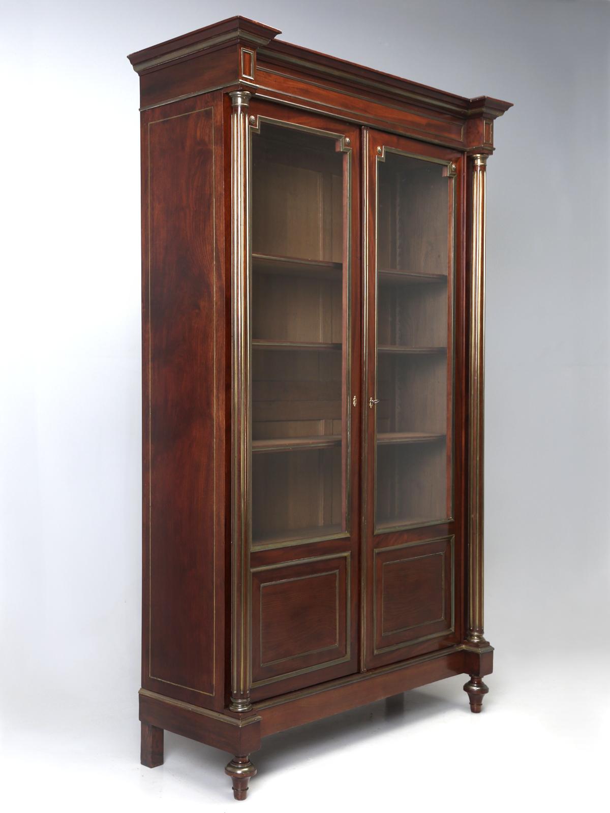 Antique French Louis XVI style mahogany and brass bookcase or bibliotheque, depending who you ask? What makes this one a little extra special, is that it required no restoration and, in our business, that is almost unheard of. This antique French