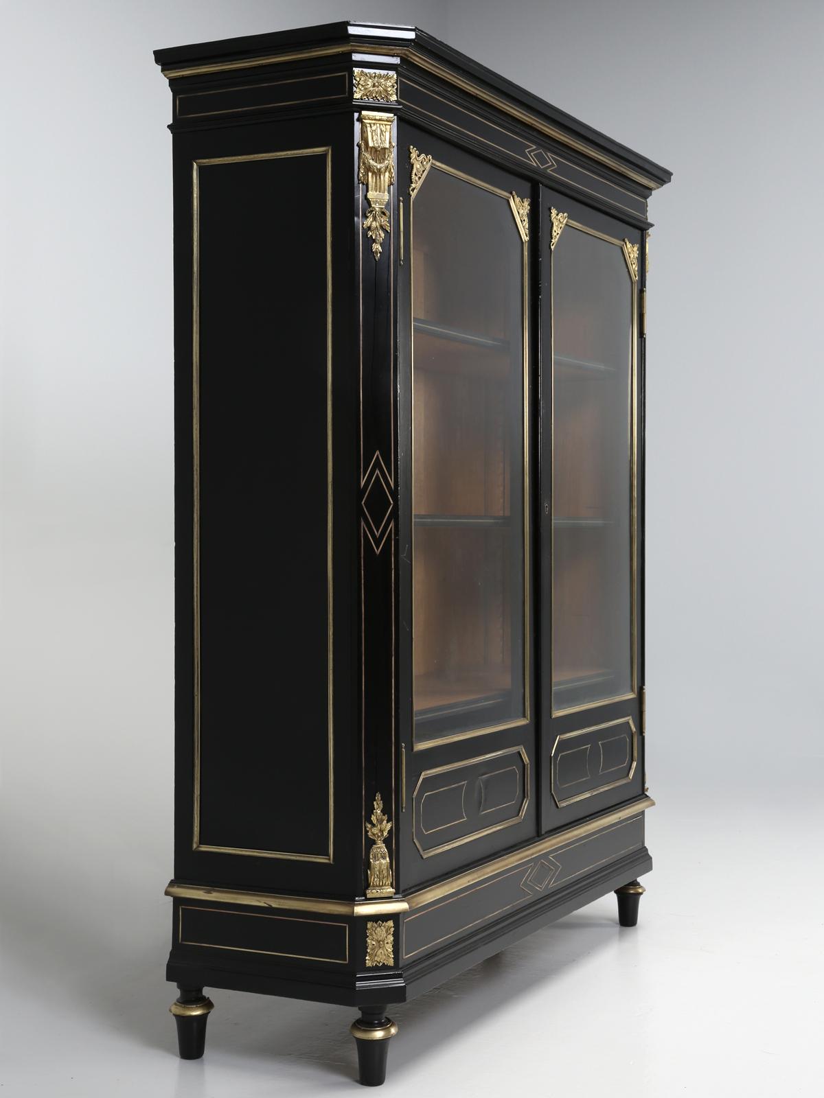 Antique French Louis XVI style black display case, curio cabinet, vitrine or bookcase and I think all the descriptions are applicable. The French expert, described this as Louis XVI style, Époque Napoléon III, which translates to the “time” of