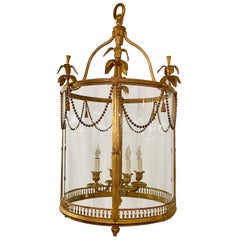 Antique French Louis XVI Style Bronze D'Oré & Curved Glass Lantern, Circa 1890.