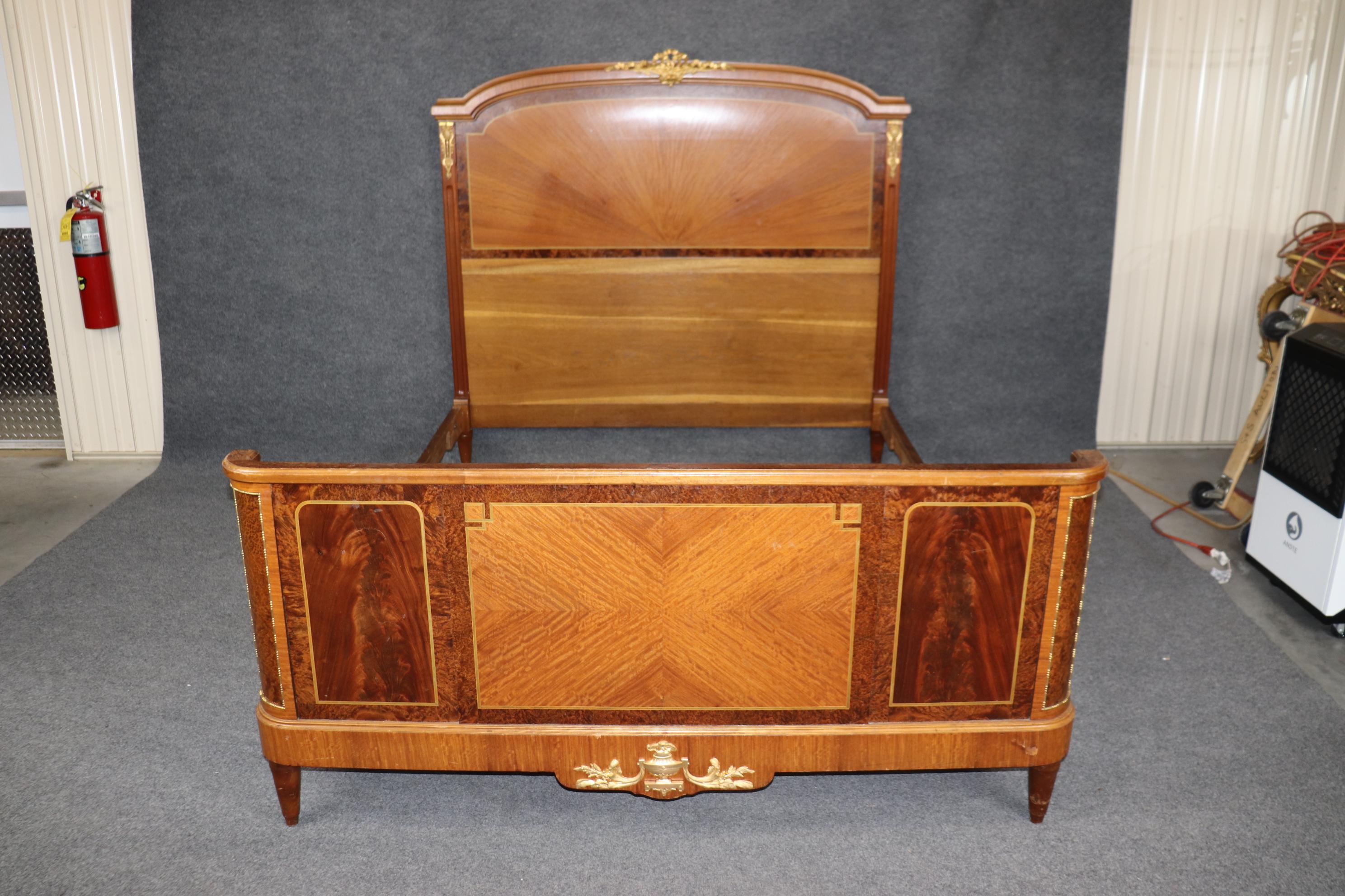 Dimensions - H: 60 1/4 in W: 64 3/4 in D: 86 1/4 in 
Interior Dimensions - W: 61 in D: 82 1/4 in

This Antique French Louis XVI Style Bronze Ormolu Mounted Bed by Mercier Freres is made of the highest quality and showcases the elegance of the turn