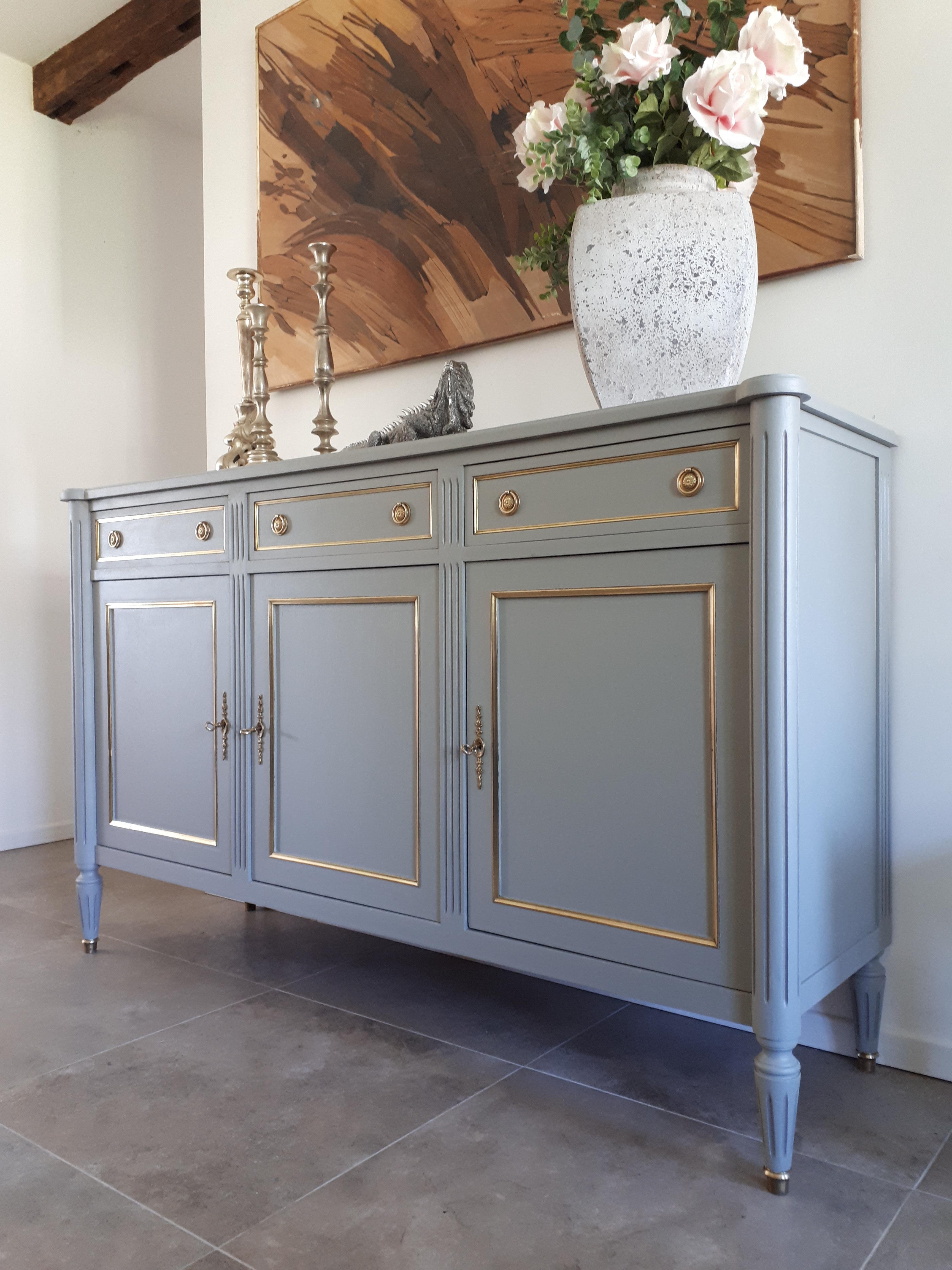 Antique French Louis XVI style buffet, fluted legs finished with golden bronze clogs.
Three dovetailed drawers and doors with brass details and keys.
Inside each compartment has a shelf for a large storage capacity.