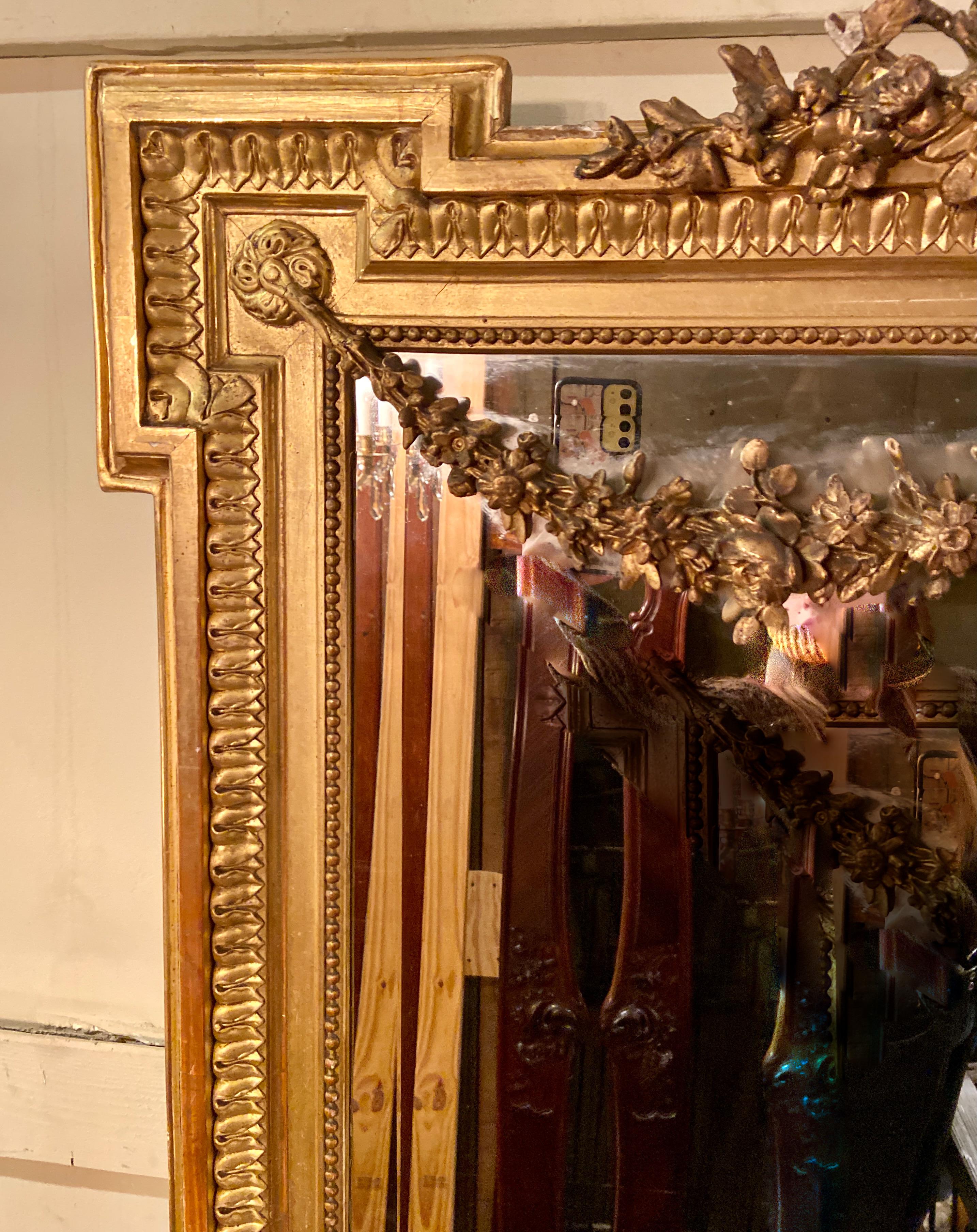 Antique French Louis XVI Style carved Gilt wood mirror with Beveling, Circa 1880.