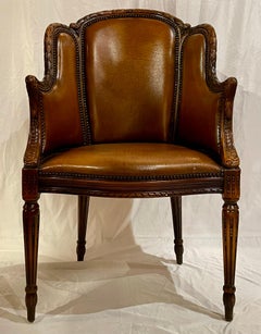 Antique French Louis XVI Style Carved Walnut and Leather Armchair, Circa 1890's.