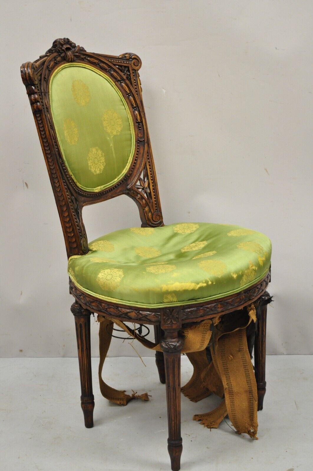 Antique French Louis XVI Style Carved Walnut Parlor side chair. Item features solid wood frame, beautiful woodgrain, nicely carved details, tapered legs, quality French craftsmanship. Circa early 1900s. Measurements: 38