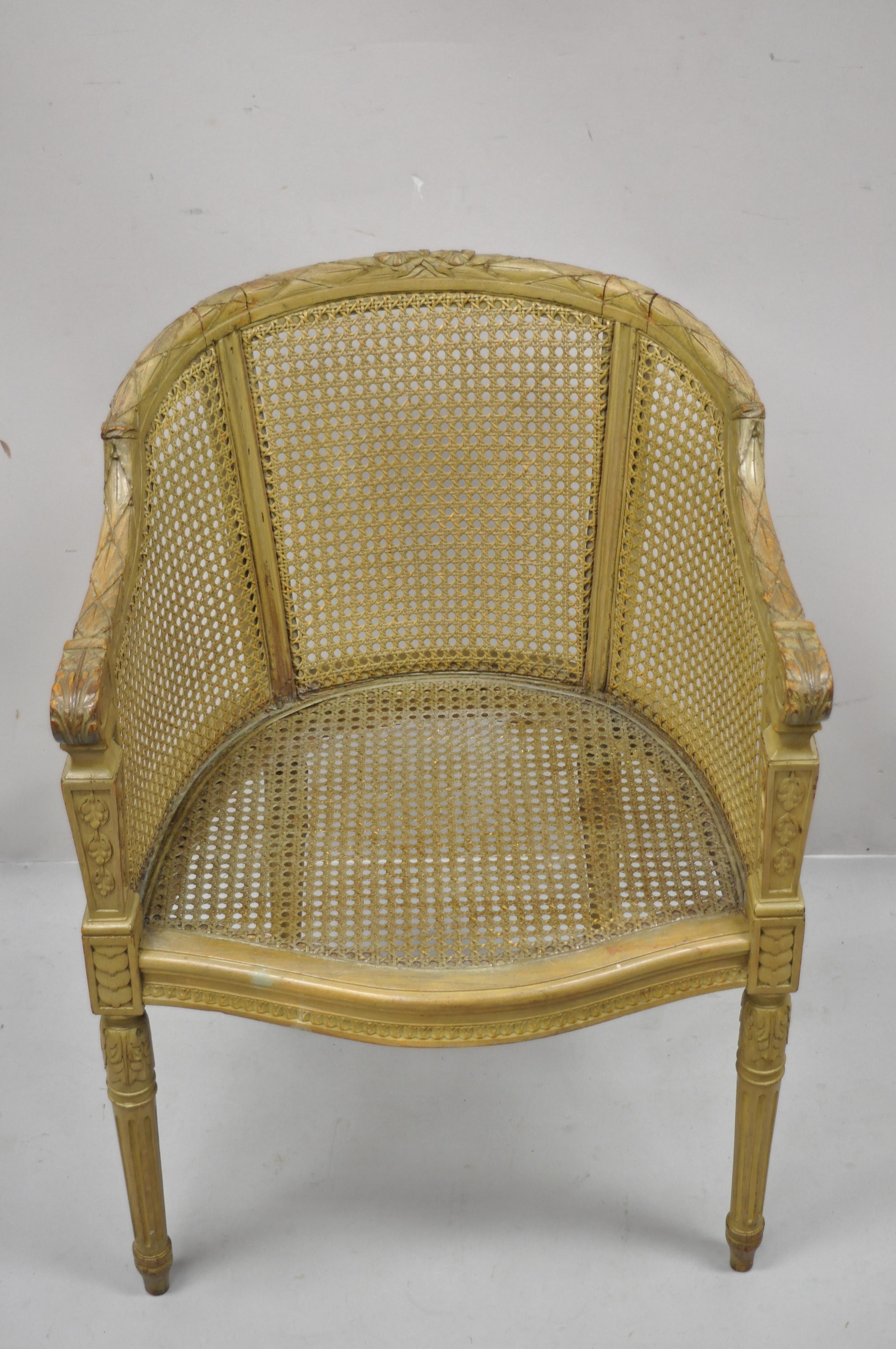 Antique French Louis XVI style carved wood cane bergere lounge arm chair. Item features cane back and sides, solid wood frame, nicely carved details, tapered legs, quality French craftsmanship, great style and form. Circa Early 1900s. Measurements: