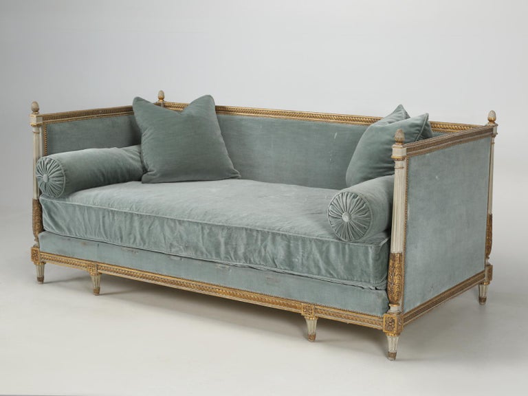 Antique French Louis XVI style daybed from the town of Joigny. This Louis XVI style daybed is completely unrestored and wears all of its original paint. Upholstery is 100% pure wool mohair and although the not new, is certainly very adequate. In the