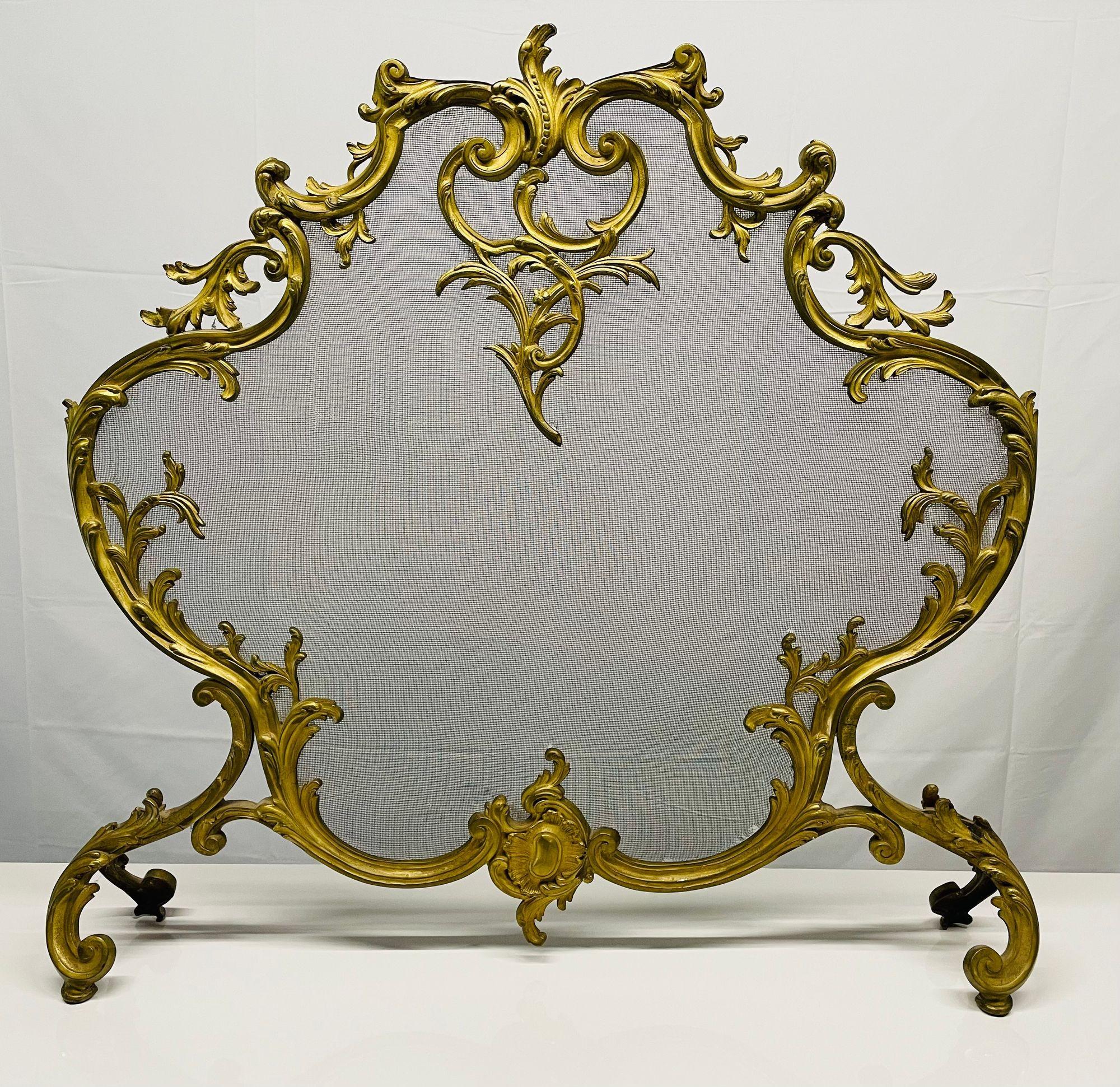 Antique French Louis XVI Style Dore' bronze fire screen, steel, mesh
 
A fine crafted dore' bronze fire screen in the Louis XVI Fashion. The whole of shell and scroll deisgn. 
 
Measures: 32 inches high 34 inches wide 6 inches deep at the