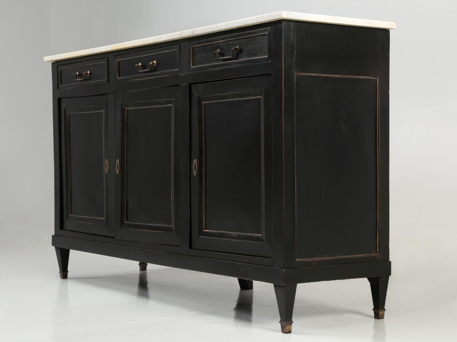 Antique French Louis XVI style buffet that our inhouse old plank workshop carefully hand-scrapped and removed the old non-restorable finish and ebonized the French buffet. We make it a store policy to hand-scrape and hand-sand our antique furniture,