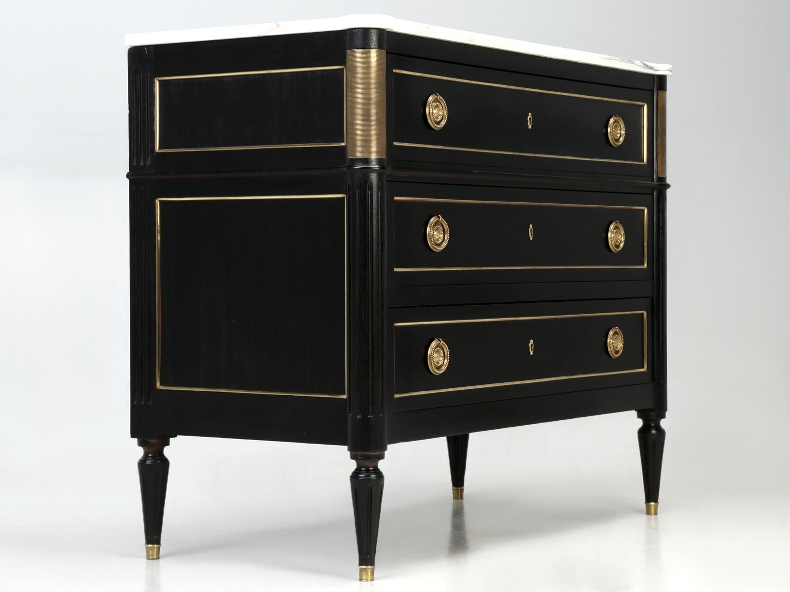 Antique French Louis XVI style commode, that our in-house Old Plank restoration department hand stripped, using no dangerous chemicals and then applied an old-world ebonized finish. This is not your typical mid-20th century commode, with a thin