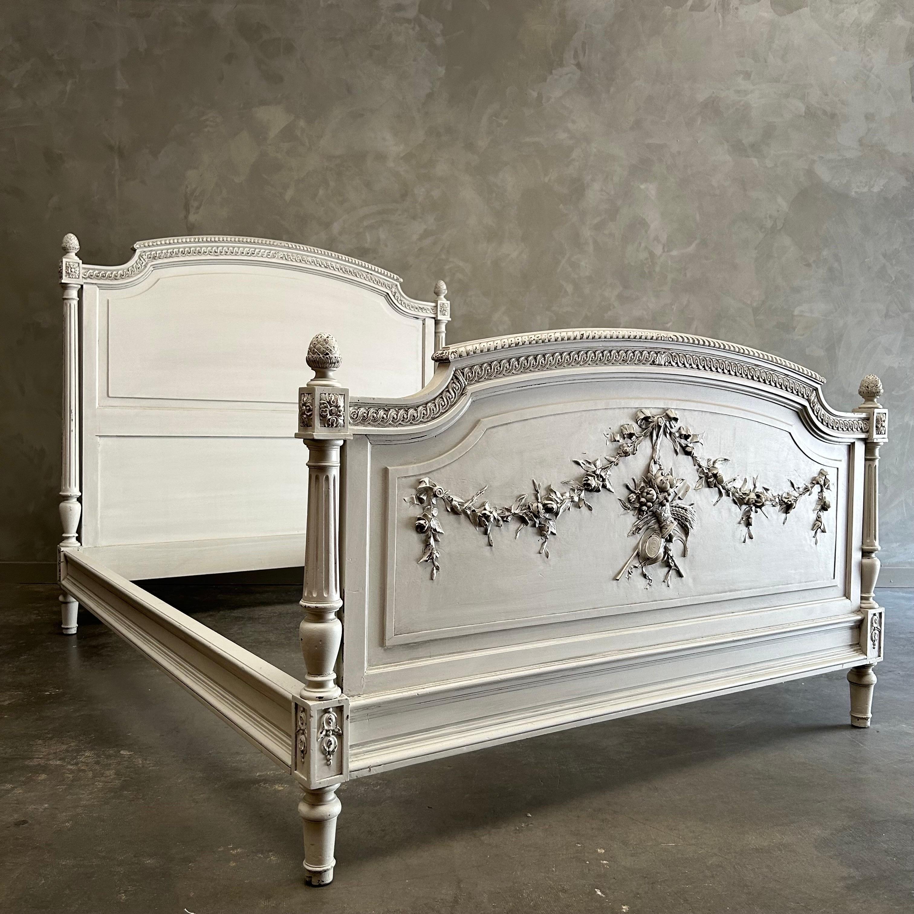 Louis XVI Style French Painted Bed
Beautiful carvings of rose swags and ribbons, with a basket of roses.
Total outter dimensions: 60”w x 79.5”d x 54.5”h
Footboard 36”h. 
Total Inside Dimensions for mattress :55.5”w x 75”d
Solid and sturdy ready for