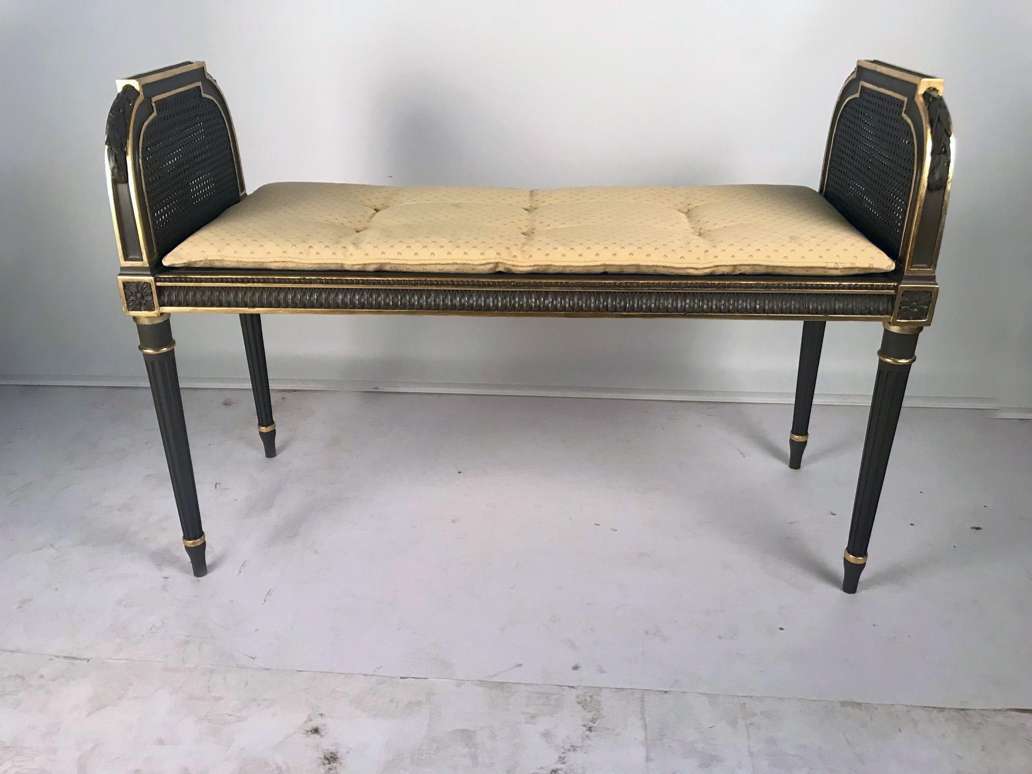 This elegant bench would be ideal as a window seat, at the foot of a bed or at a dressing table or even a piano. The ends are double-caned with the caning in original condition and applied with acanthus swags. It is raised on turned fluted tapering