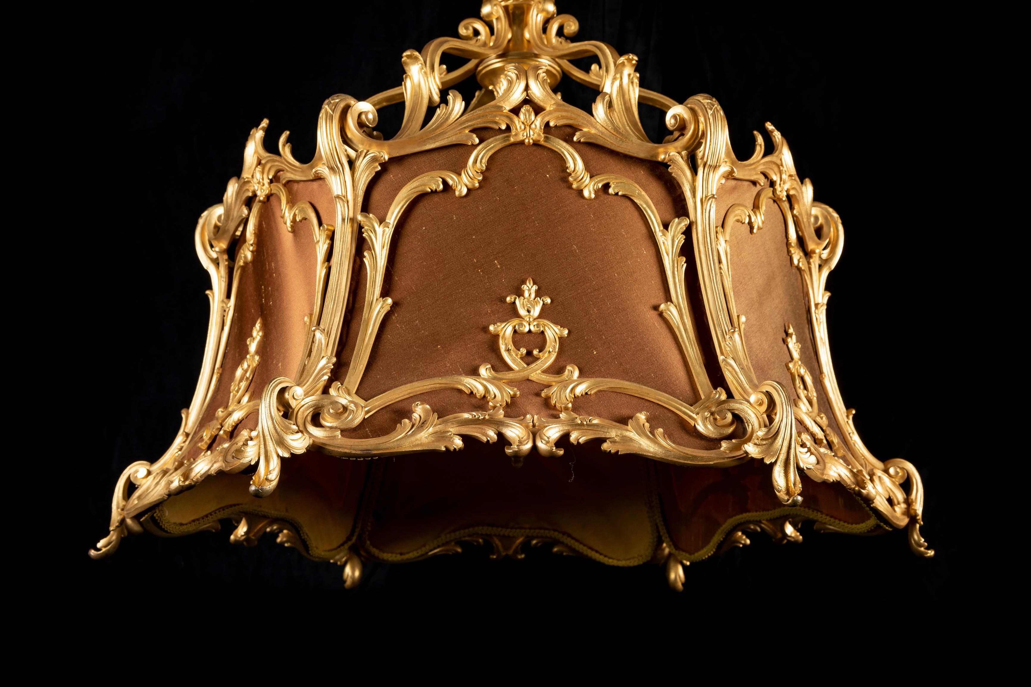 A Very unusual Antique French Louis XVI/ Art Nouveau Style gilt bronze and silk fabric multi light octagonal form chandelier of exquisite craftsmanship. This unique chandelier is of octagonal shape and constructed of six gilt bronze panels