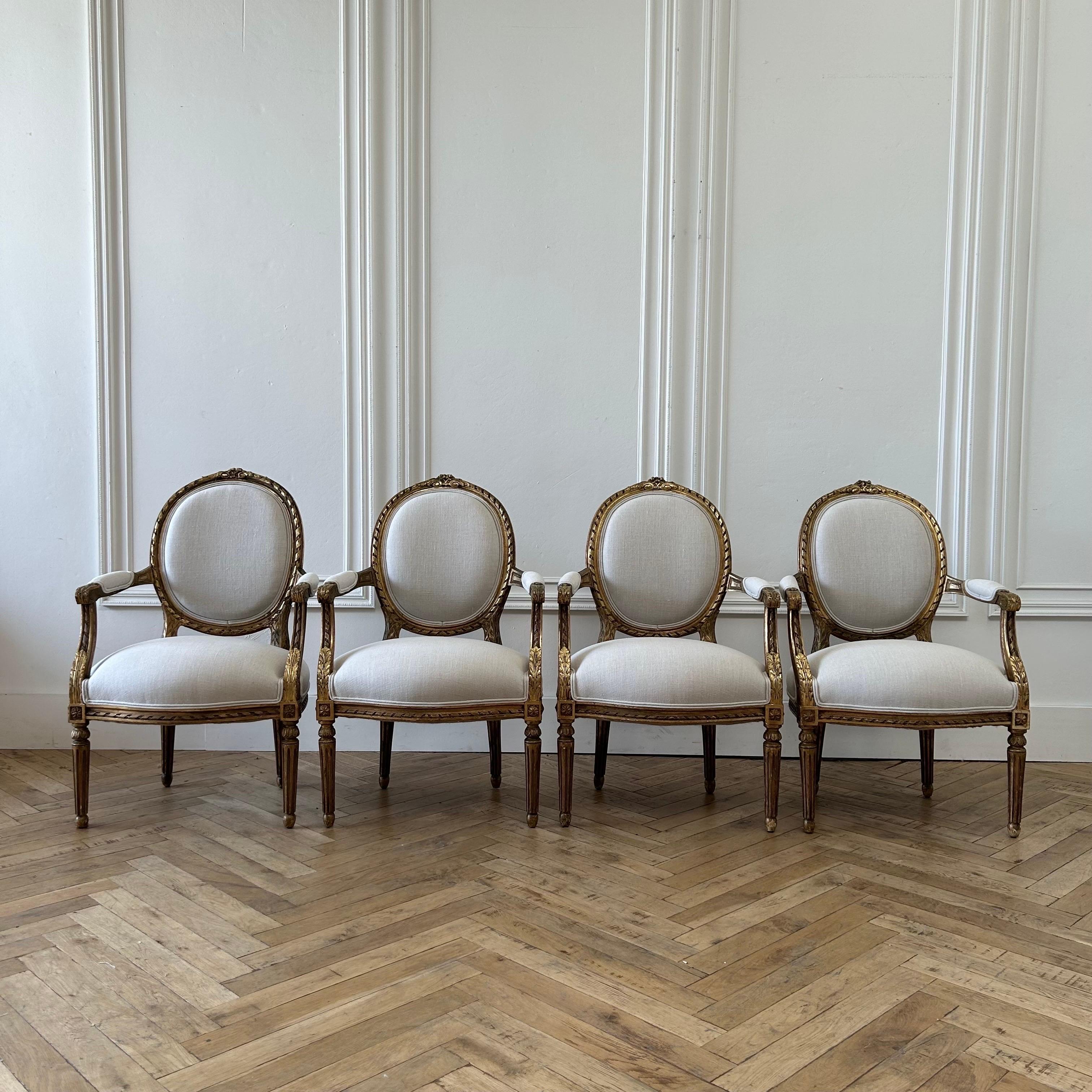 Antique French Louis XVI Style Gilt Wood Upholstered Linen Arm Chairs For Sale 11