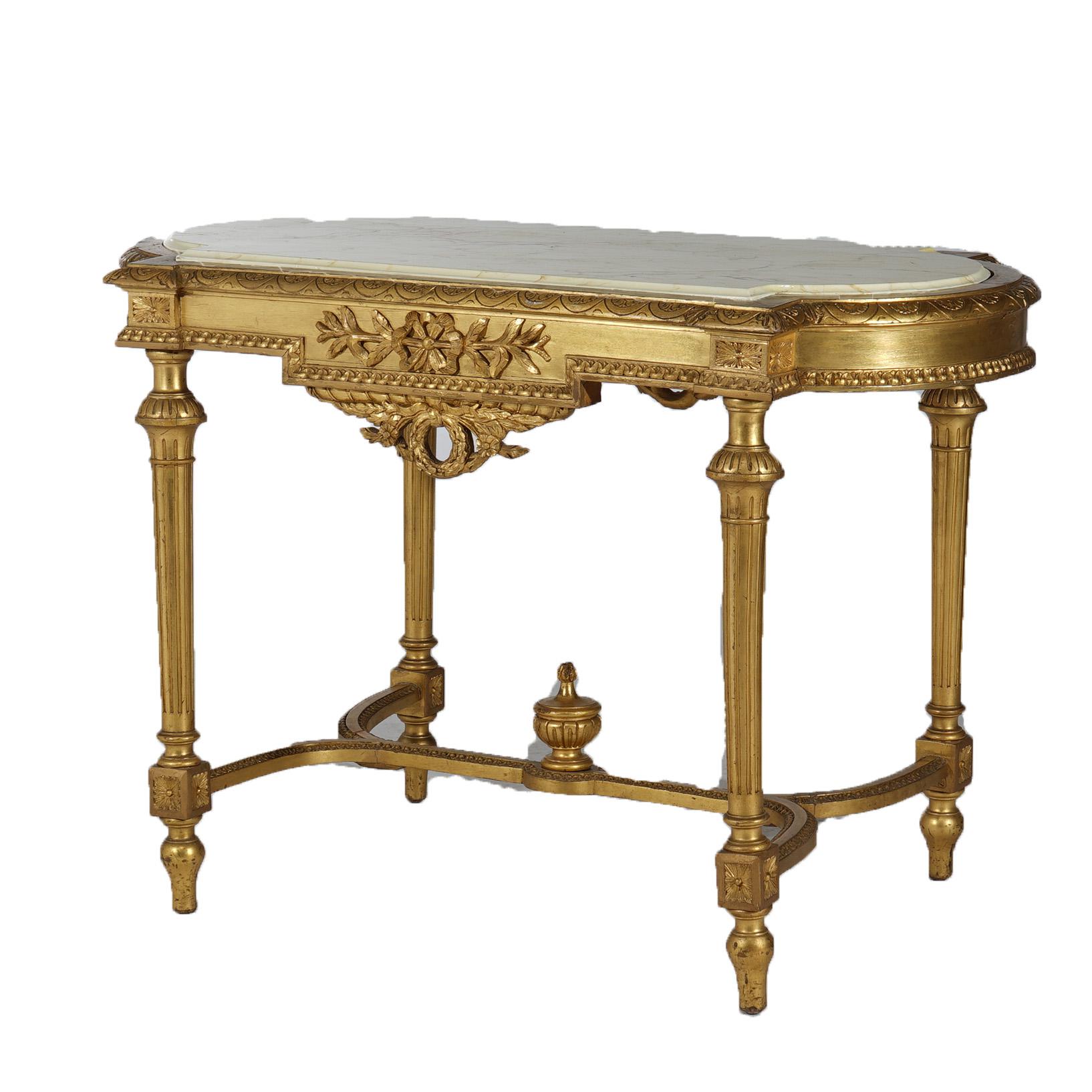 ***Ask About Discounted In-House Shipping***
An antique French Louis XVI style parlor table offers shaped and faux painted top over giltwood base having foliate elements throughout, raised on turned tapered fluted legs with stretcher having central