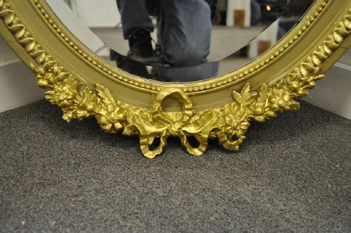 Antique French Louis XVI Style Gold Gilt Torch Flame Gesso Oval Wall Mirror In Good Condition For Sale In Philadelphia, PA
