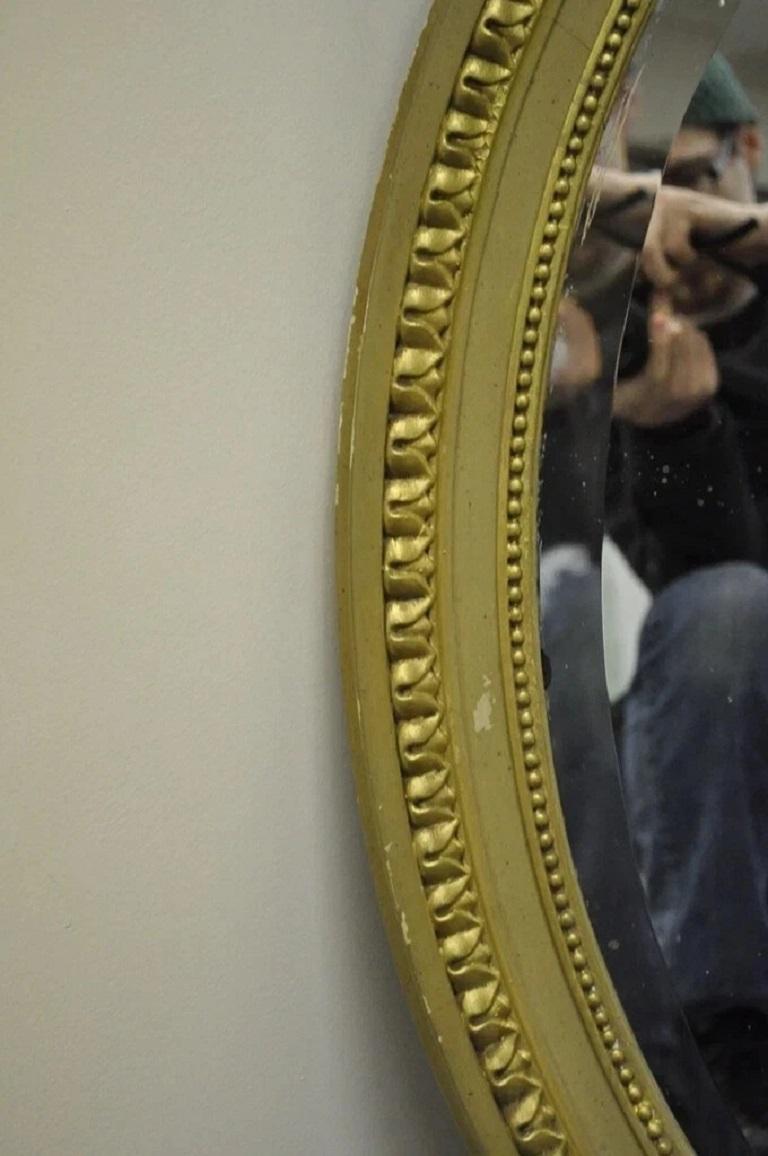 19th Century Antique French Louis XVI Style Gold Gilt Torch Flame Gesso Oval Wall Mirror For Sale