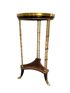 Guéridon ancien de style Louis XVI par Henry Dasson.