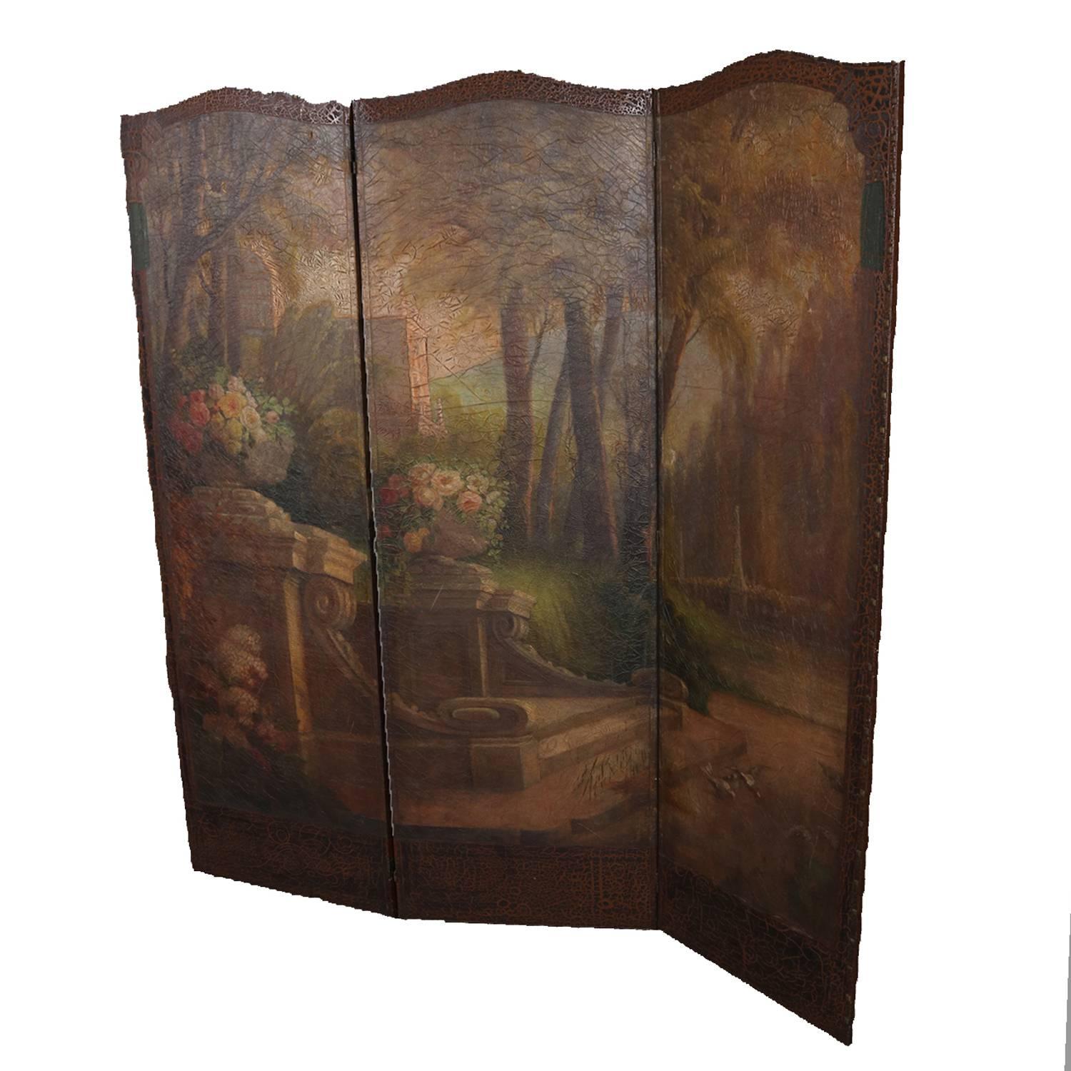 Antique French Louis XVI style dressing or dividing screen features three panels with continuous hand painted landscape garden screen on leather and attached with bronze brads, circa 1880

Measures: 69.5