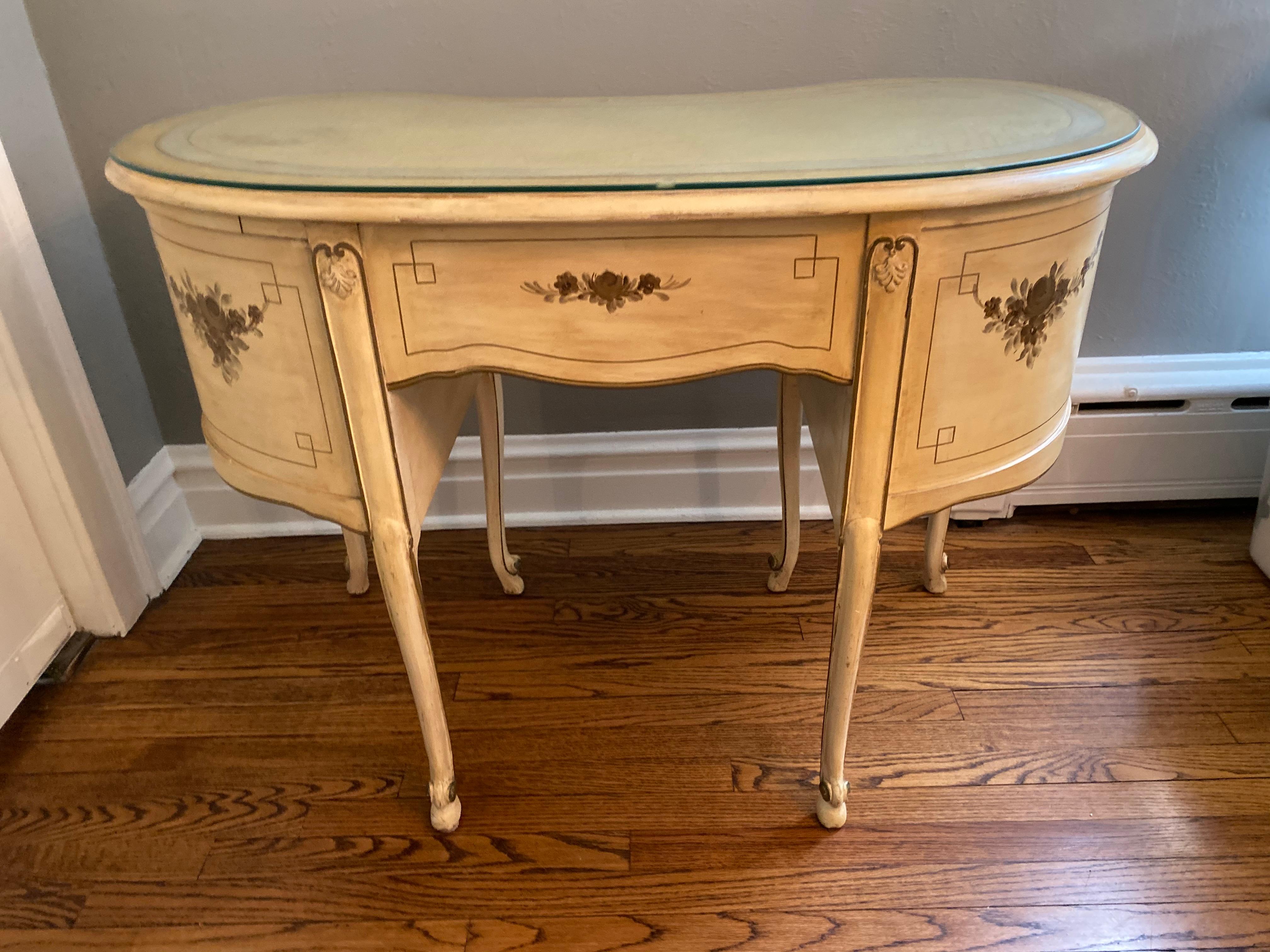 Vintage hand painted ladies vanity or writing desk
kidney shaped, delicate cabriole legs, antique white hand rubbed with sweet hand painted detail on all sides.
Stunning 19th century French Louis XVI lady's vanity / writing desk . This Gorgeous