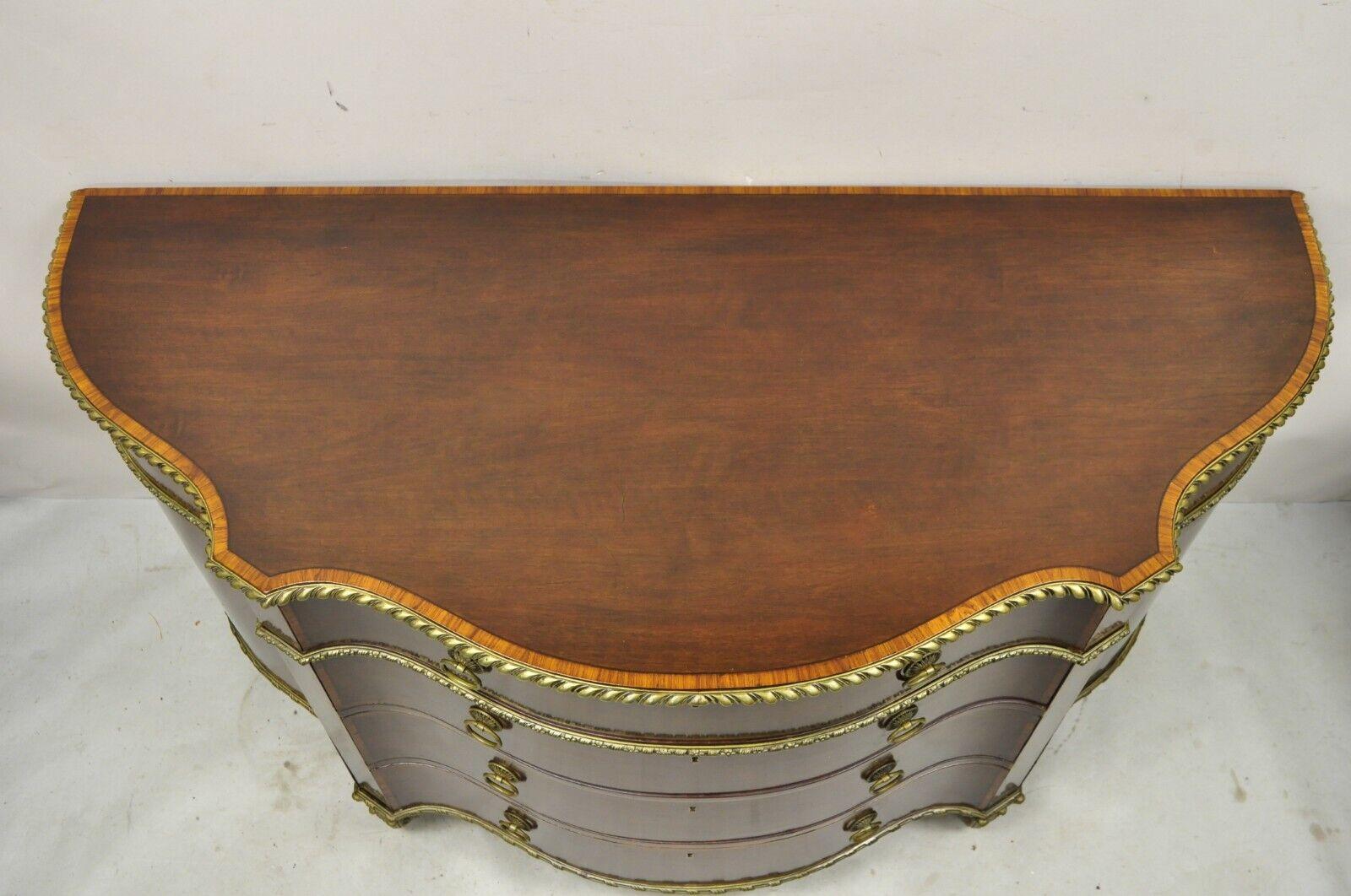 Antique French Louis XVI Style Mahogany Bow Front Bombe Demilune Commode Chest. Item featured is a lower height, shapely demilune form, remarkable cast bronze ormolu and feet, 2 swing doors, beautiful wood grain, banded inlay throughout, 4