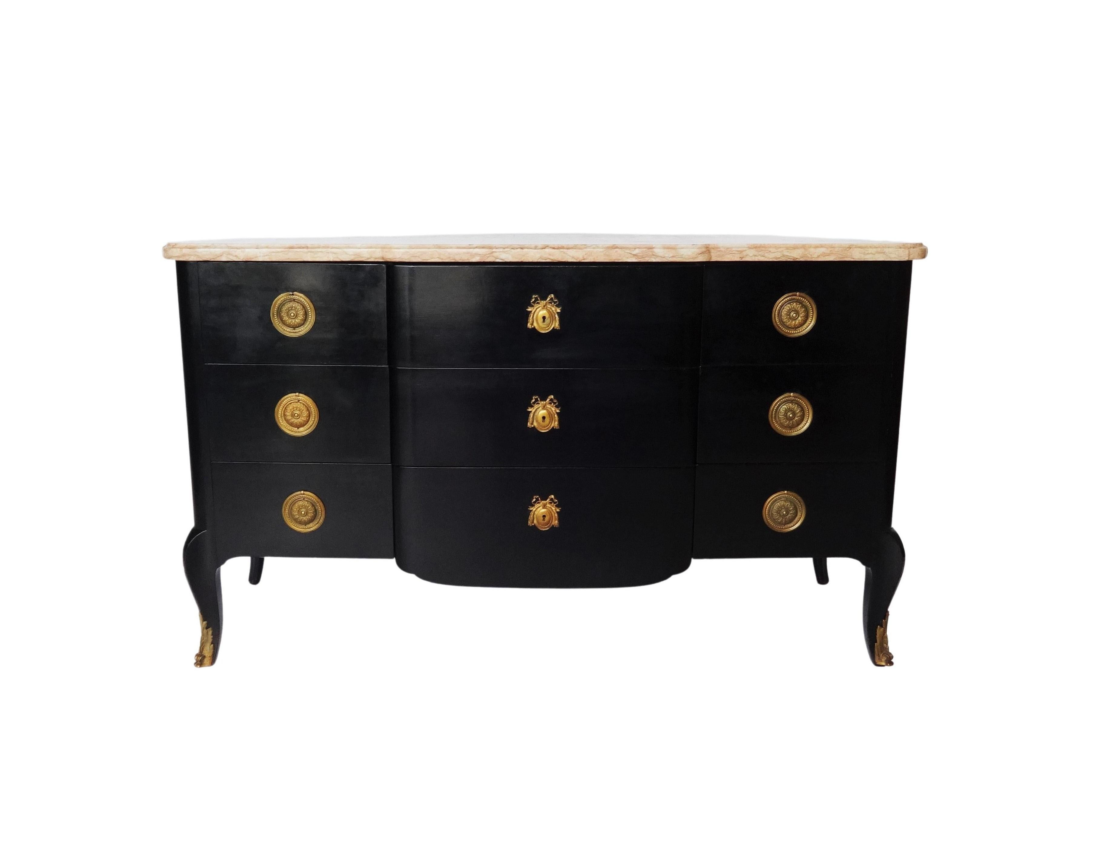 Antique French mahogany marble-top Louis XVI style commode has been ebonized and finished with a museum quality. This lovely piece features pink and grey veined marble-top. The chest has three large drawers in the middle and six small drawers on