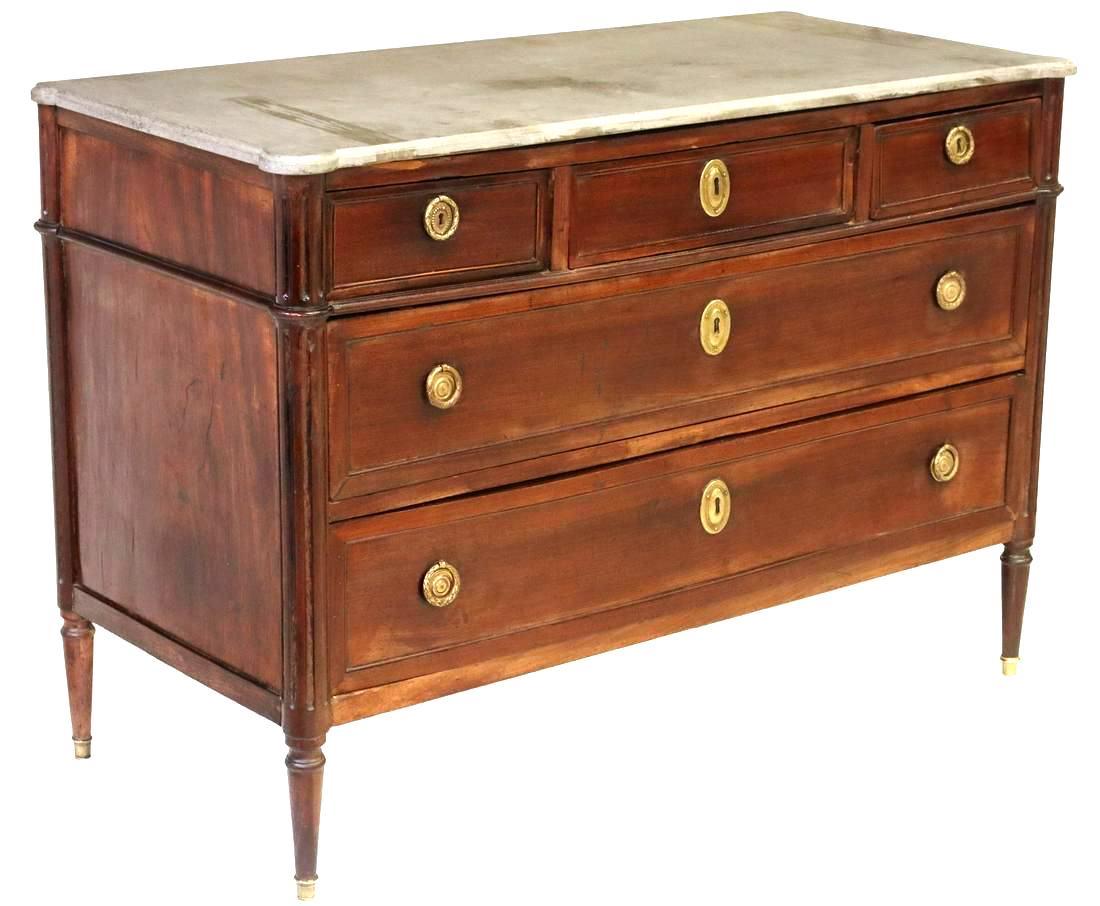 French Louis XVI style mahogany commode, late 19th/ early 20th c., having gray stone top, three top drawers, over two full length drawers, flanked by fluted side supports, rising on tapered legs, ending on capped feet, stone with tape residue,