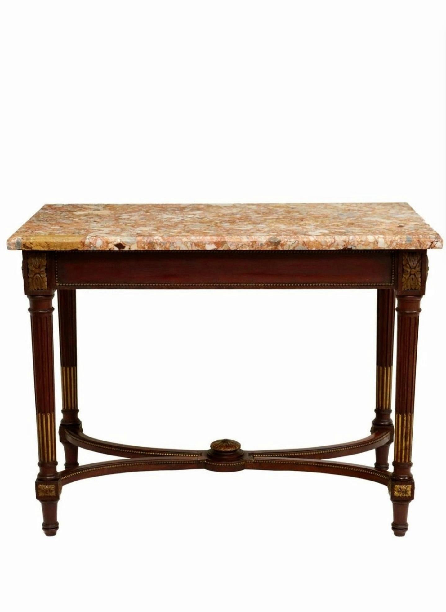 A lovely antique French Louis XVI style mahogany centre table. 

Hand-crafted in France in the late 19th / early 20th century, exceptionally executed in sophisticated 18th century King Louis Sixteenth taste, topped with a striking Breche d’Alep