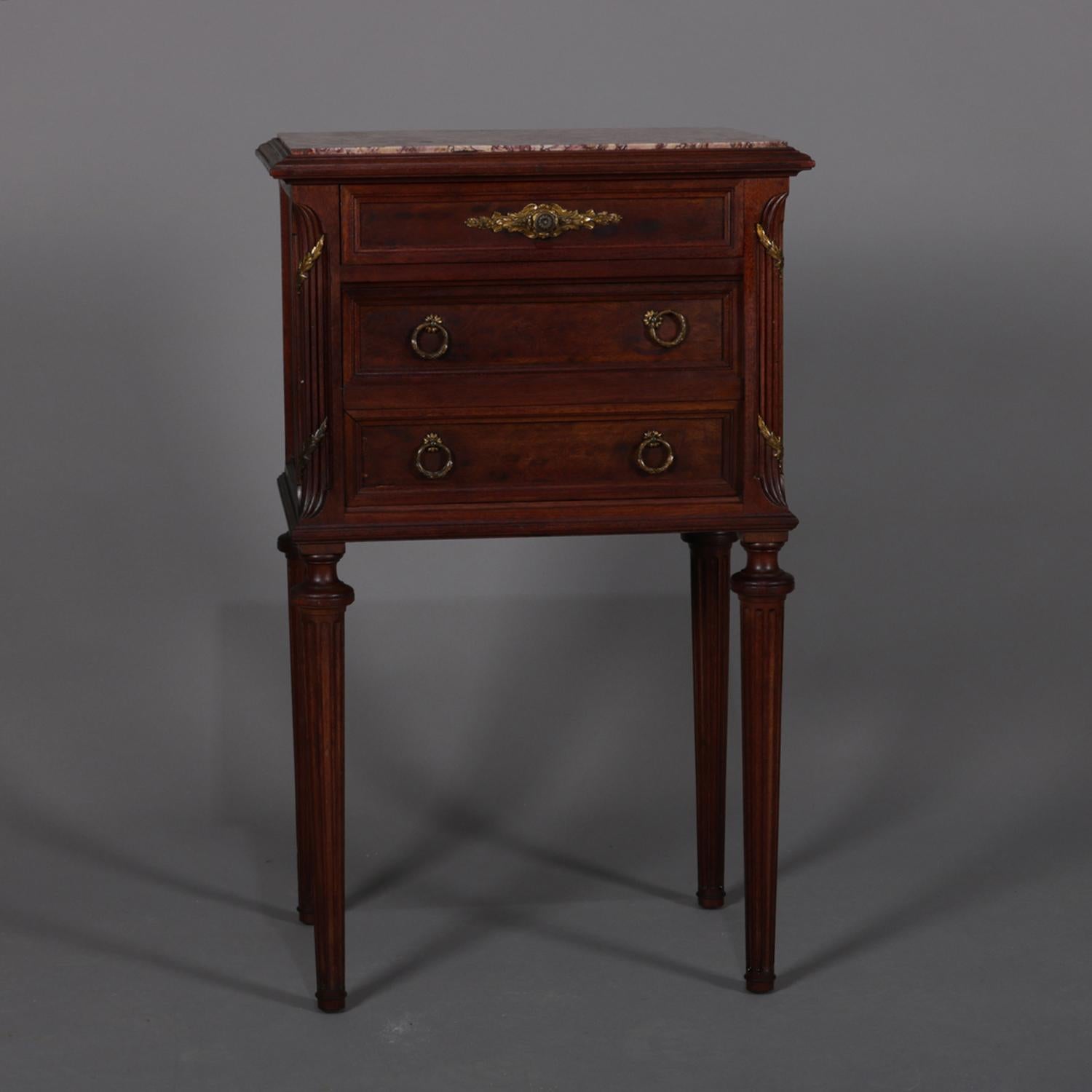 Antique French Louis XVI humidor features marble top surmounting mahogany base having upper drawer and lower cabinet raised on tapered and reeded legs, bronze pulls throughout, circa 1900.

Measures: Overall 30.75