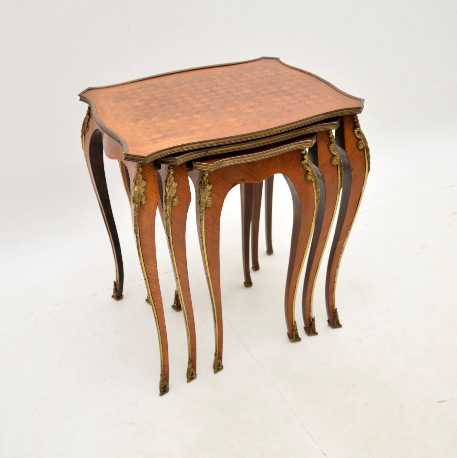 A beautiful and elegant antique French nest of tables, dating from around the 1920-30’s period.

The quality is fabulous, these are very well made with a beautiful inlaid design and gilt bronze mounts.

We have had these recently French polished,