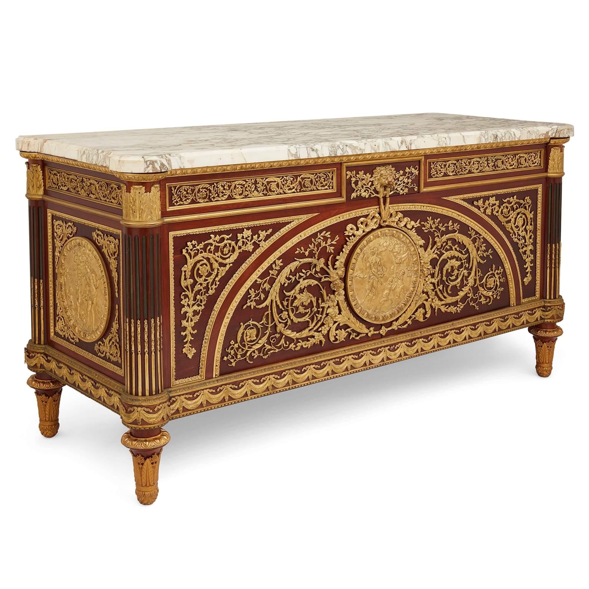 Antique French Louis XVI style ormolu-mounted commode after Benneman 
French, Early 20th Century
Height 93cm, width 179cm, depth 69cm

This outstanding commode à vanteaux is after a design by Joseph Stockel (1743-1802) and Guillaume Benneman (1750-