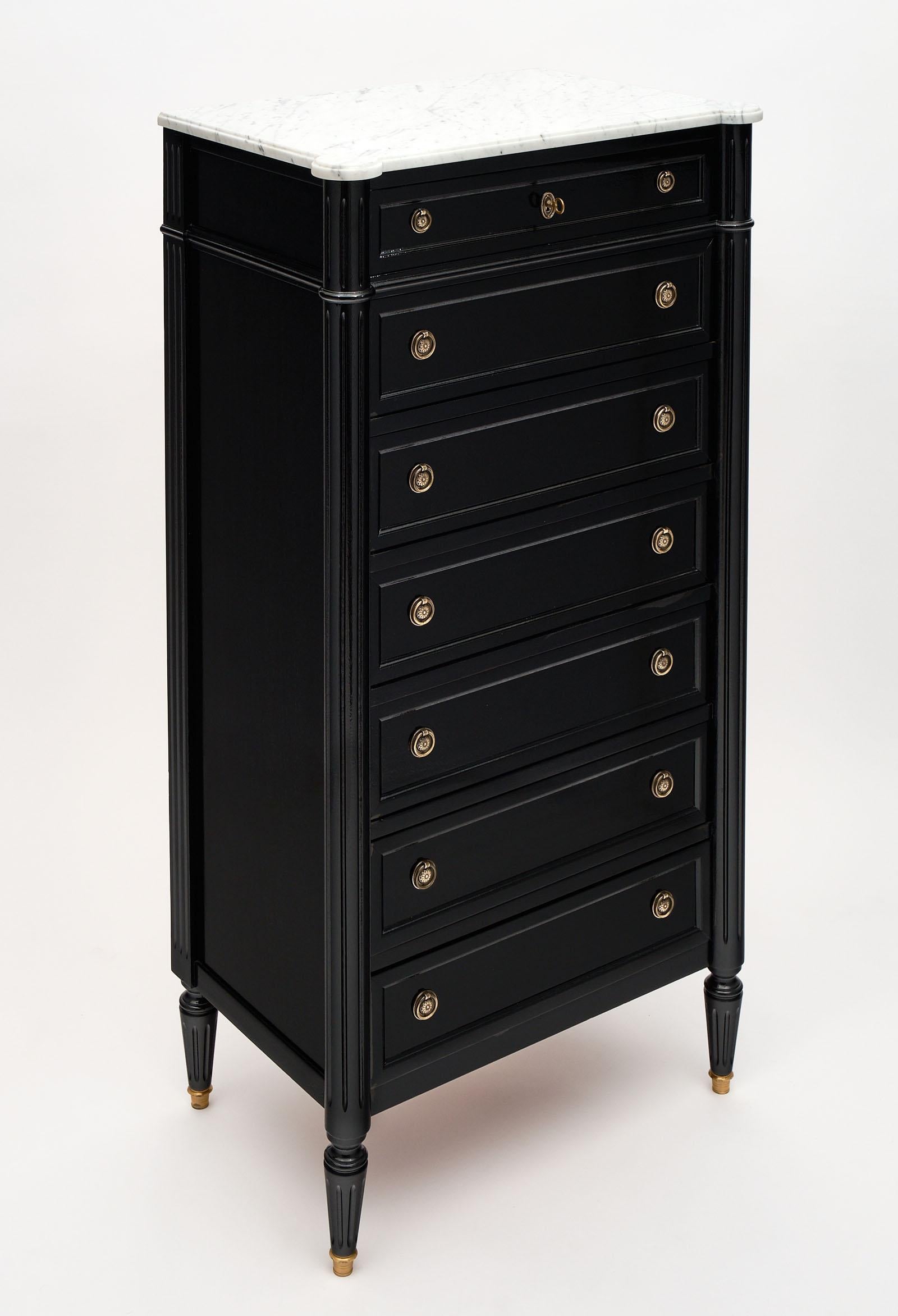 French antique Louis XVI style semainier made of mahogany and finished with an ebony French polish for a lustrous shine. This piece has seven dovetailed drawers, one for each day of the week, giving it the name semainier (semaine meaning week).