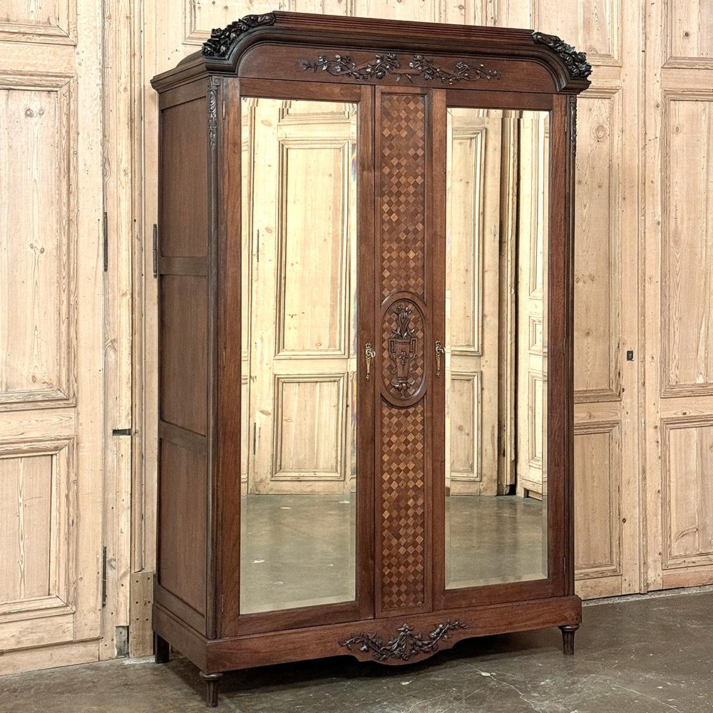 Antique French Louis XVI Walnut Armoire ~ Wardrobe is a majestic example of the neoclassical revival that captivated the attentions of Louis XVI and his Queen Marie Antoinette.  Crafted from fine French walnut, it features a rectilinear architecture