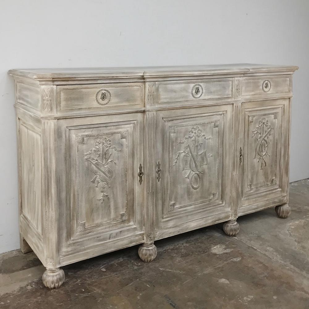 Antique French Louis XVI Whitewashed Buffet is a more casual design than typical, enabling one to use it in a relaxed setting or one that is slightly more formal with ease! Three cabinets and as many drawers have been hand carved in bas relief with