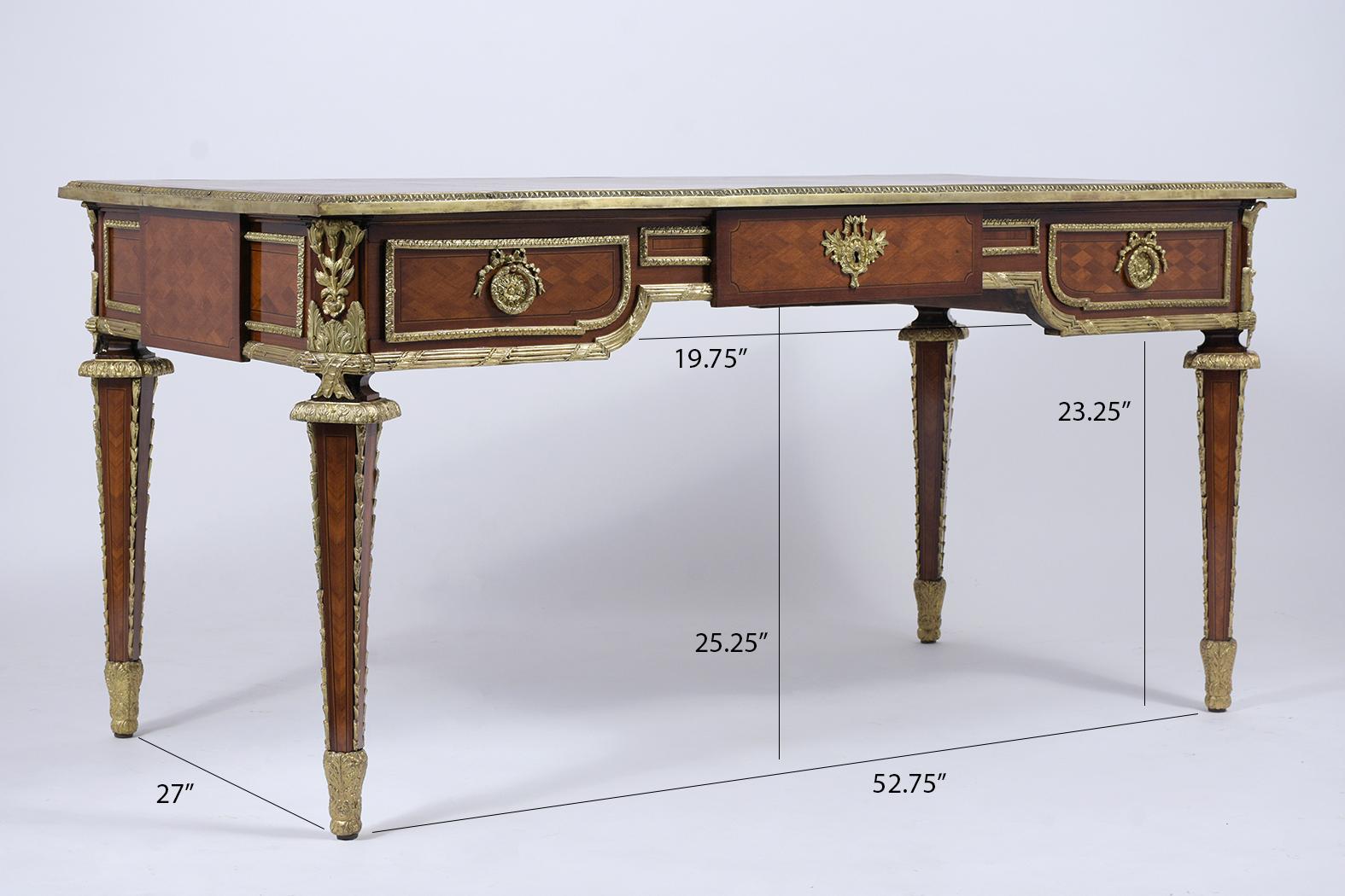 This Antique Louis XVI Desk is made of mahogany wood covered with remarkable marquetry veneers, and its original mahogany color sealed with a clear varnish finish has been professionally restored. This exceptional desk features the original Whiskey