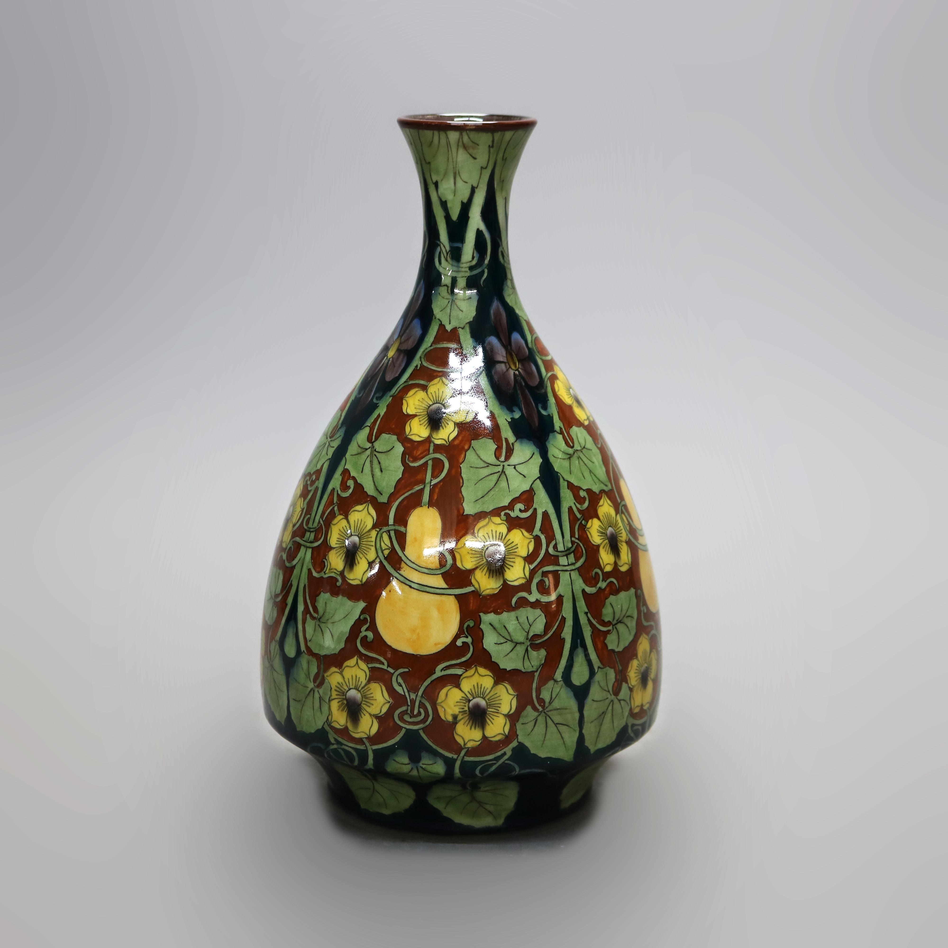 An antique French Luneville Aesthetic vase offers faience pottery construction in bulbous form with hand painted garden decoration having gourd and vine, maker stamped on base as photographed, 19th century

Measures- 12.25''H X 6.75''W X