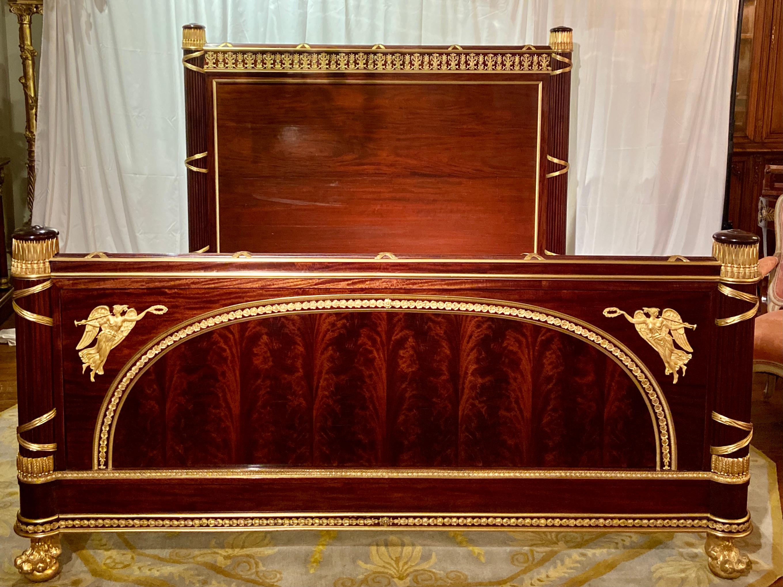 Antique French museum quality mahogany and ormolu king-size bed by Master Ebeniste, France, Circa 1880-1890's. One of the finest originals offered for private sale.
Measurements: 
Headboard: 64 inches High x 78 inches Wide
Footboard: 38-1/2