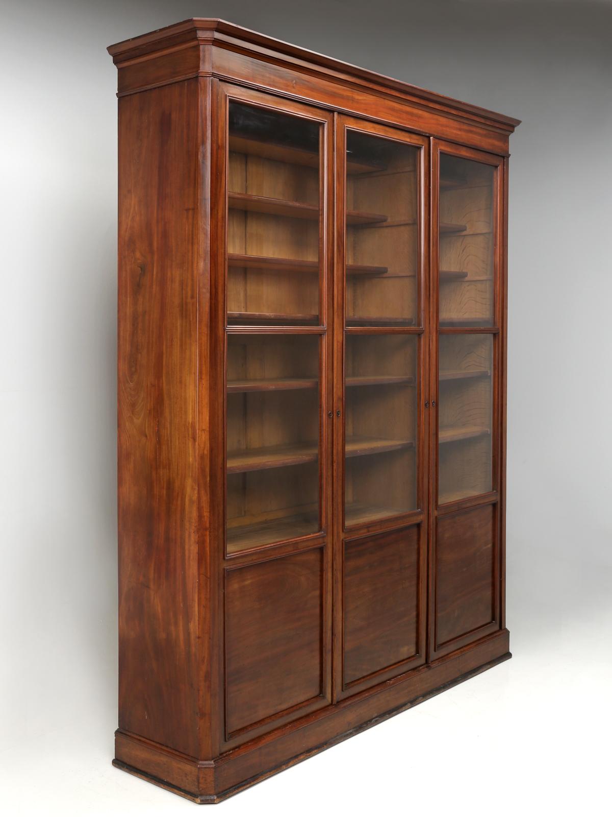 Antique French bookcase (bibliotheque), China cabinet or Display cabinet, that was handcrafted about 120-140-years ago. Our solid mahogany antique French bookcase, was discovered near the town of Narbonne (established by the Romans in 118 BC) and