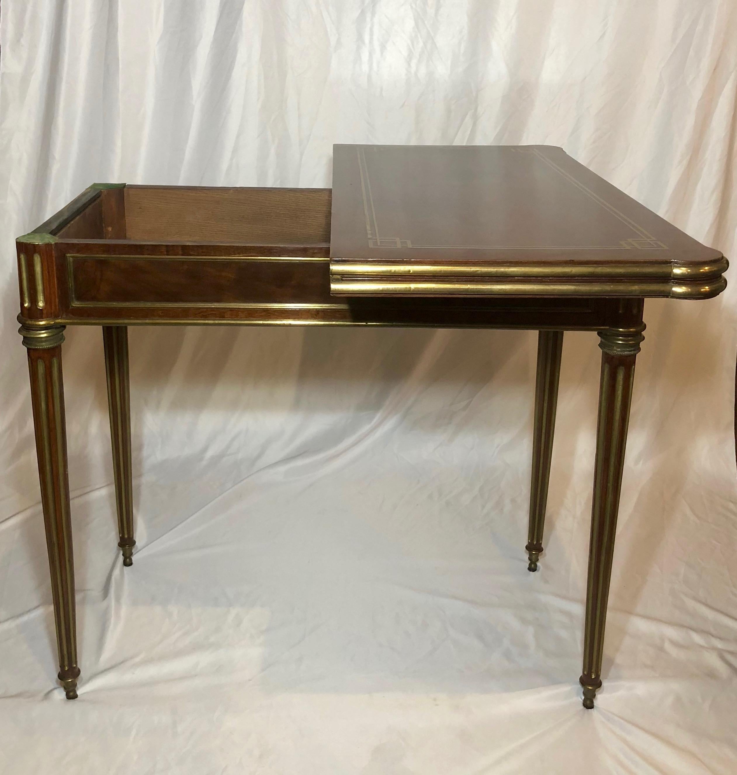 Antique French mahogany games table with brass mounts, circa 1870-1880.