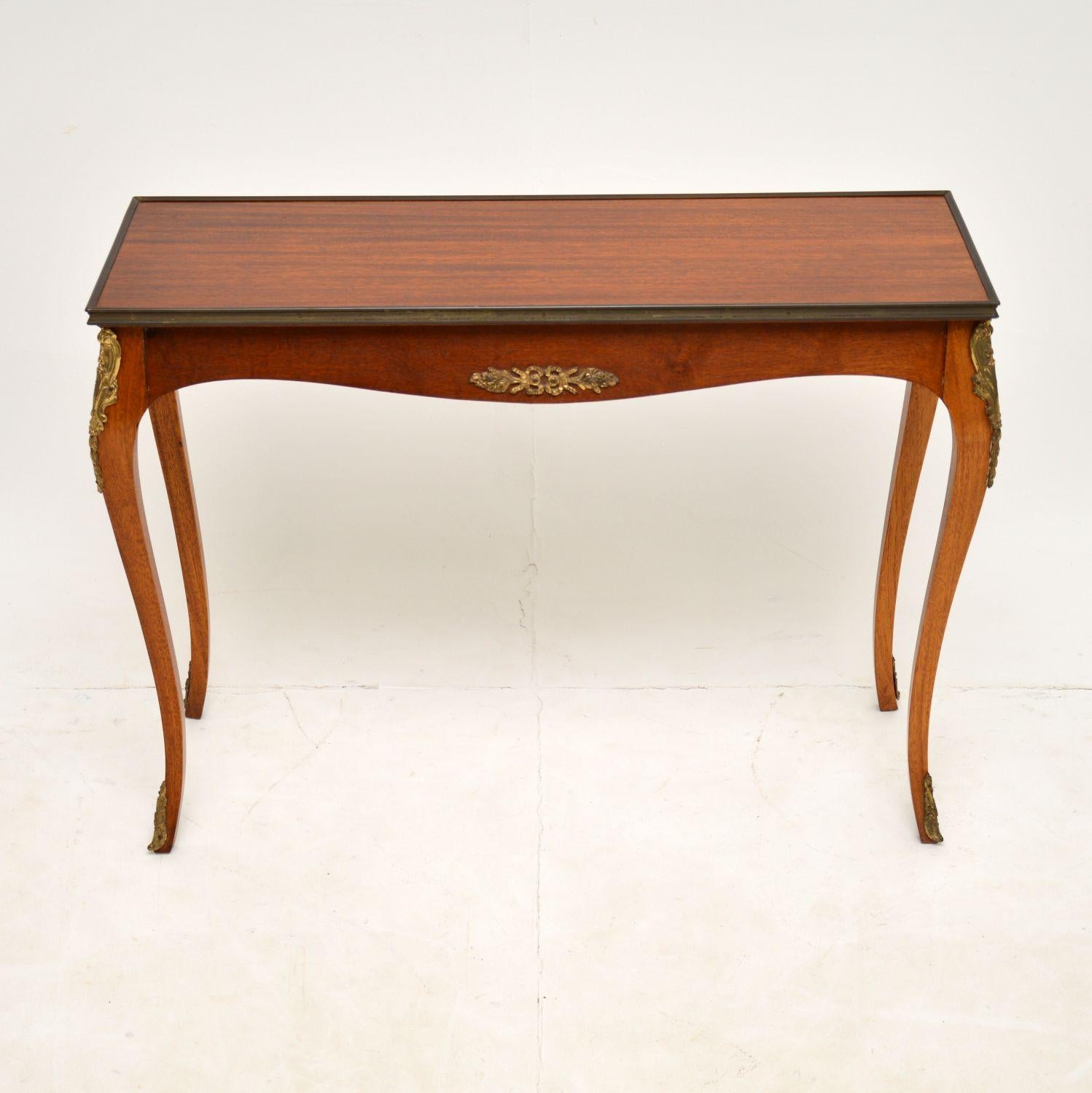 A lovely and unusually small proportioned wooden side table. This was made in France & dates from the 1920-30’s.

It is an unusual size, though it’s designed to look like a console table, it is actually only a little bigger than a coffee table. It