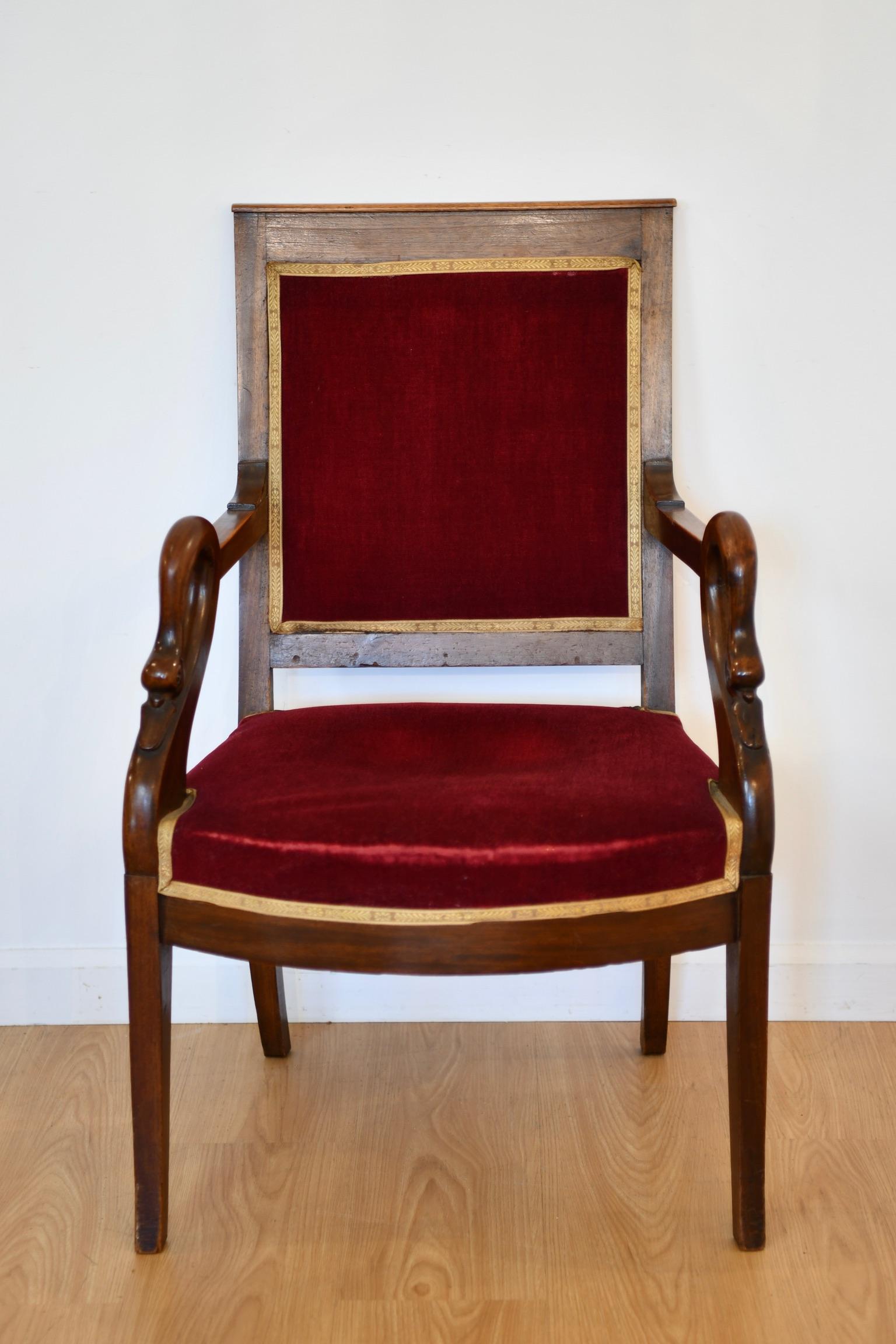 French carved mahogany armchair with swan heads, circa 1930. Two available, sold individually. Matching chaise longue available. Suken seats; may need new springs. Dimensions: 35
