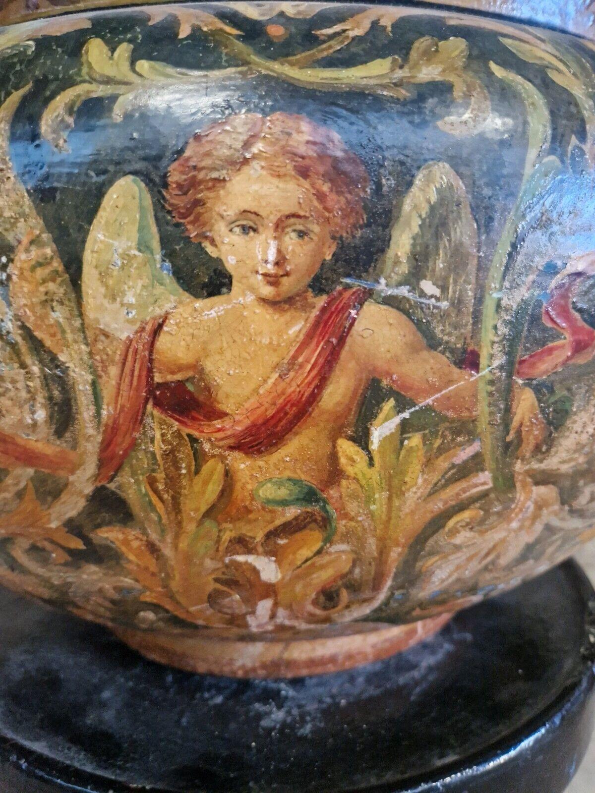 Add a touch of Victorian charm to your home with this exquisite antique French Majolica jardinière pot and plinth from the 19th century. The beautifully crafted ceramic pot features a stunning multicolored design of grotesques and cherubs, perfect