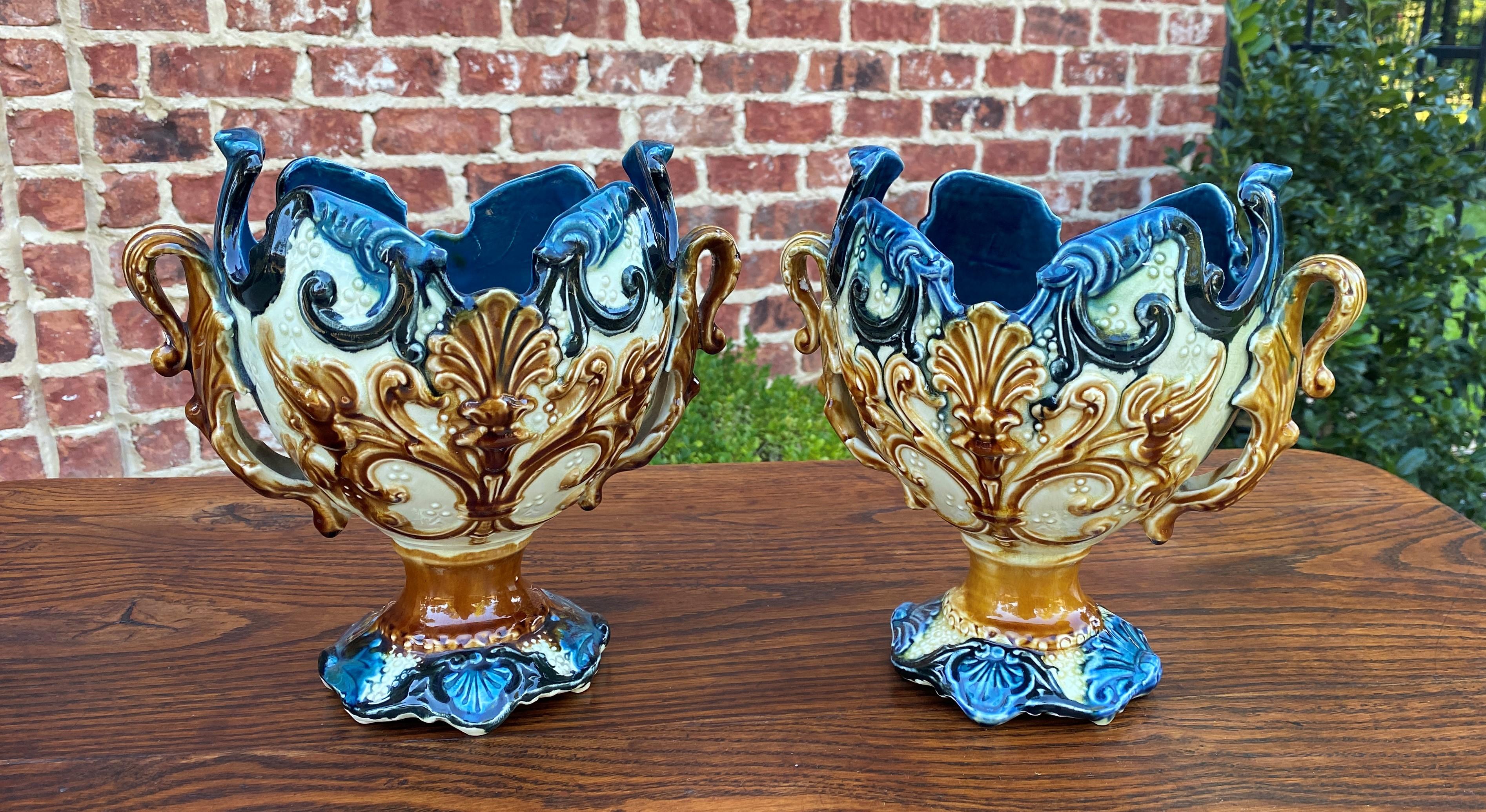 Gorgeous Pair Antique French Majolica Cache Pots, Planters, Jardinieres, Flower Pots or Vases~~c. 1900

Authentic French majolica planters or cache pots~~vibrant colors of teal, brown, gold, green and many more~~a must have for