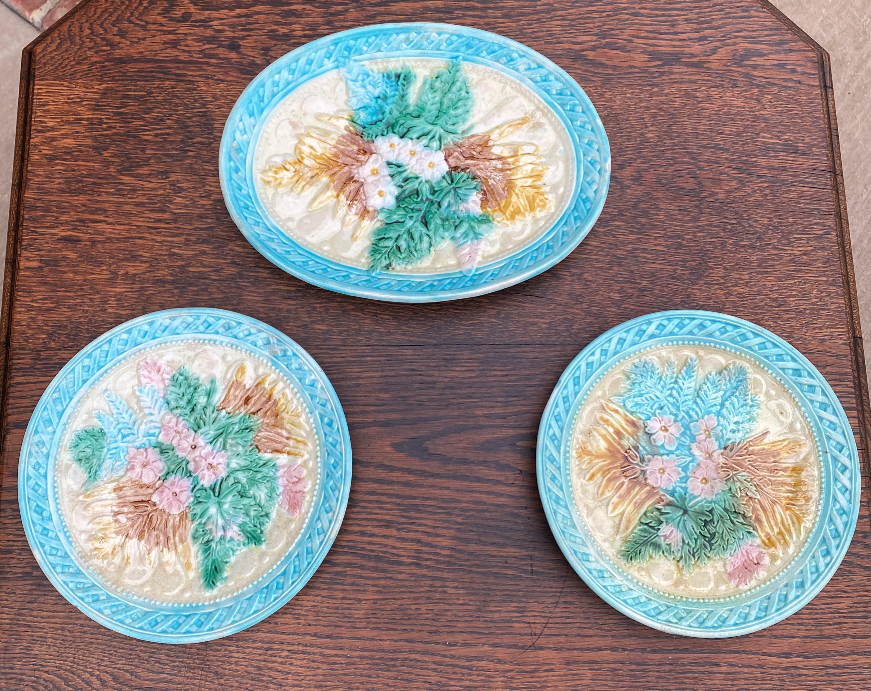 Gorgeous set of 3 antique French majolica plates (2) and platter (1)~~pastel floral design~~c. 1880s-90s

Authentic French majolica set of 2 matching plates and 1 platter~~beautiful pastel blue, pink, green, yellow, and brown floral and leaf