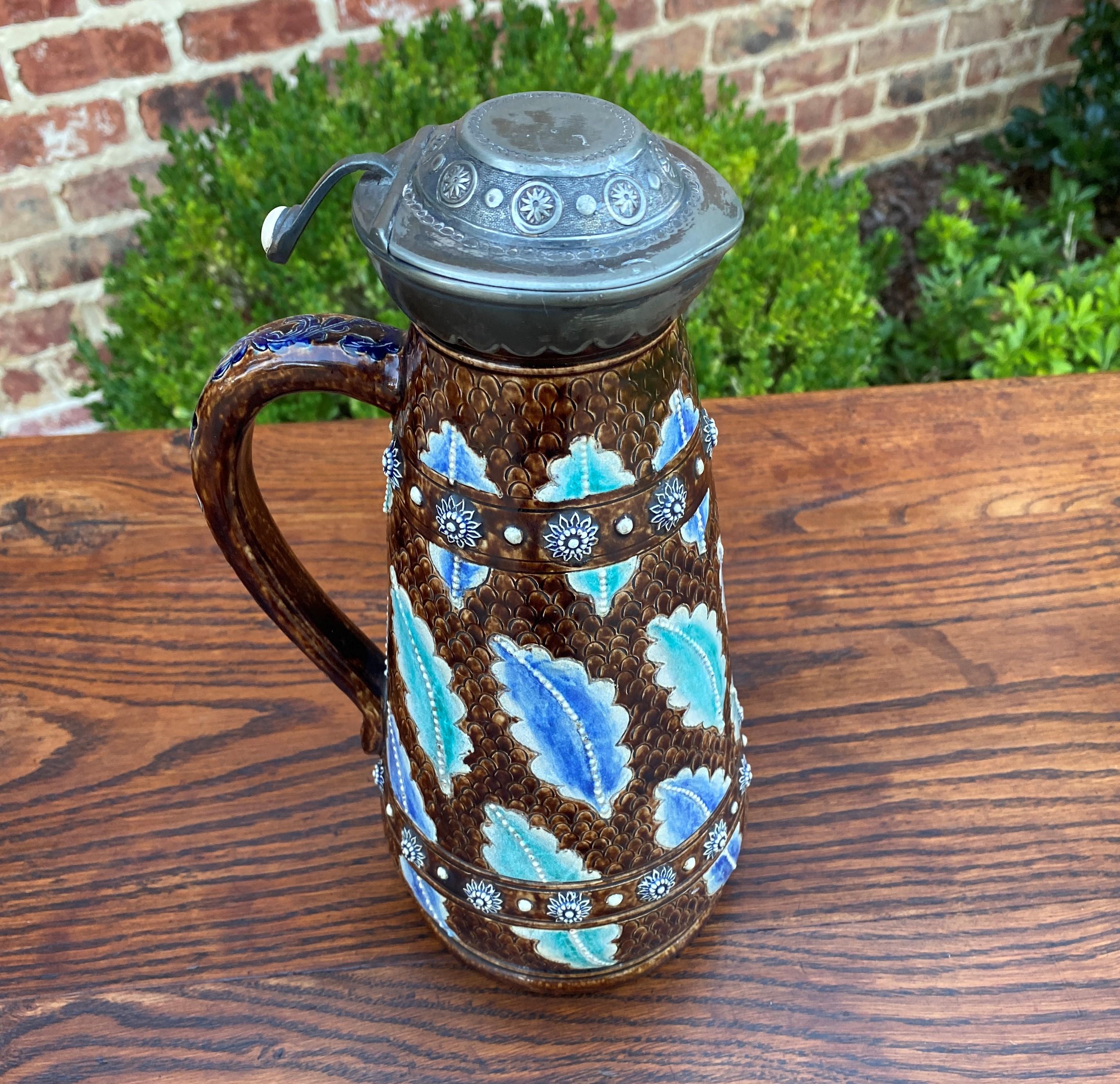 Unique and beautiful antique French Majolica Stein, Jug or Pitcher~~Silver or Pewter Hinged Lid~~c. 1900

Authentic French Majolica stein~~vibrant colors of brown, green, and blue~~a must have for collectors!

Although most of our inventory is