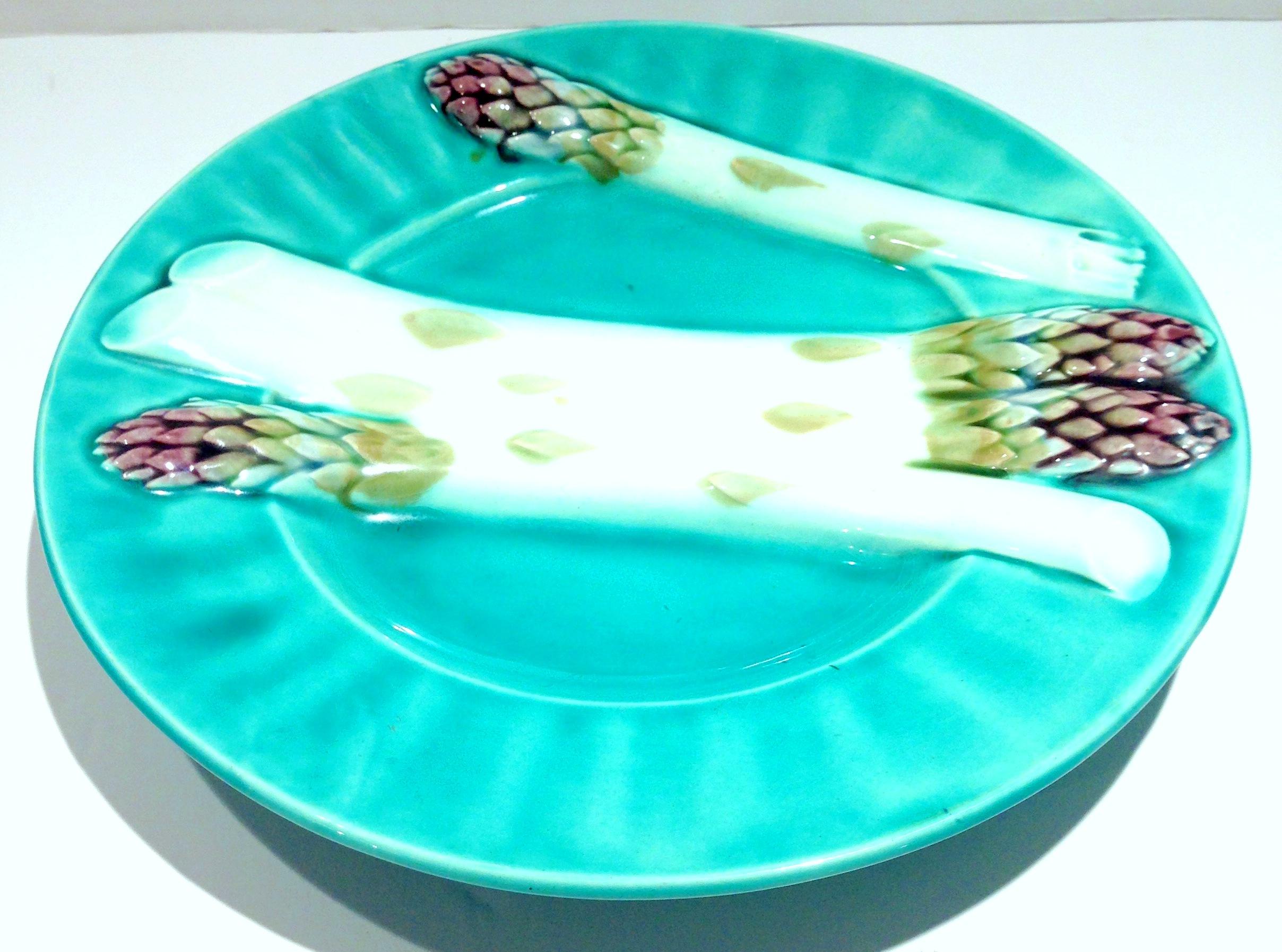 Early 1900'S Turquoise French Majolica asparagus plate with white, green and purple asparagus relief design. Signed on the underside, Depose K et G Lunville.