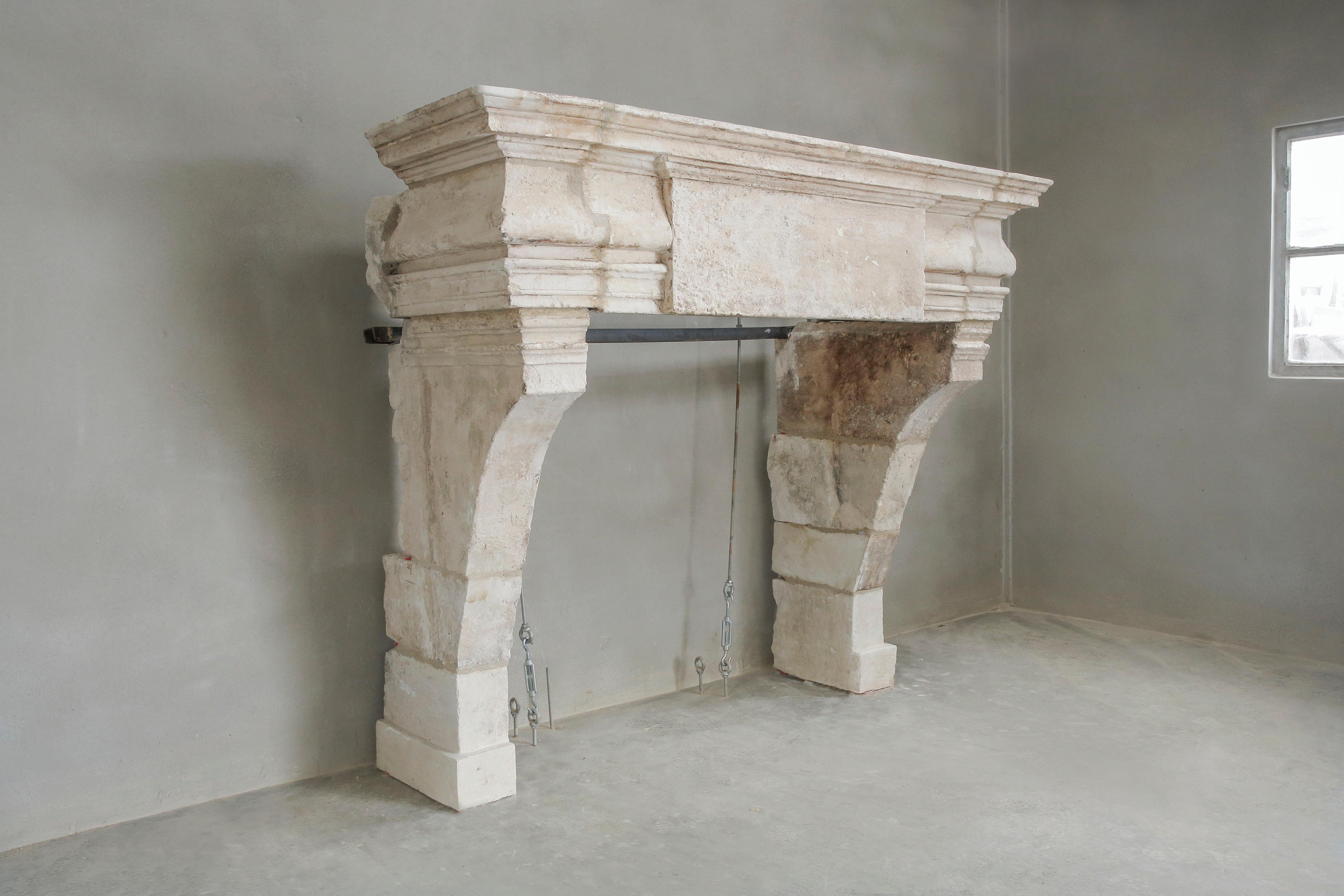 A robust antique French limestone chimney! The chimney has a very wide top with beautiful lines that make the chimney even more stately. Also the interruption in the top with the rectangular ornament ensures that this chimney only becomes more