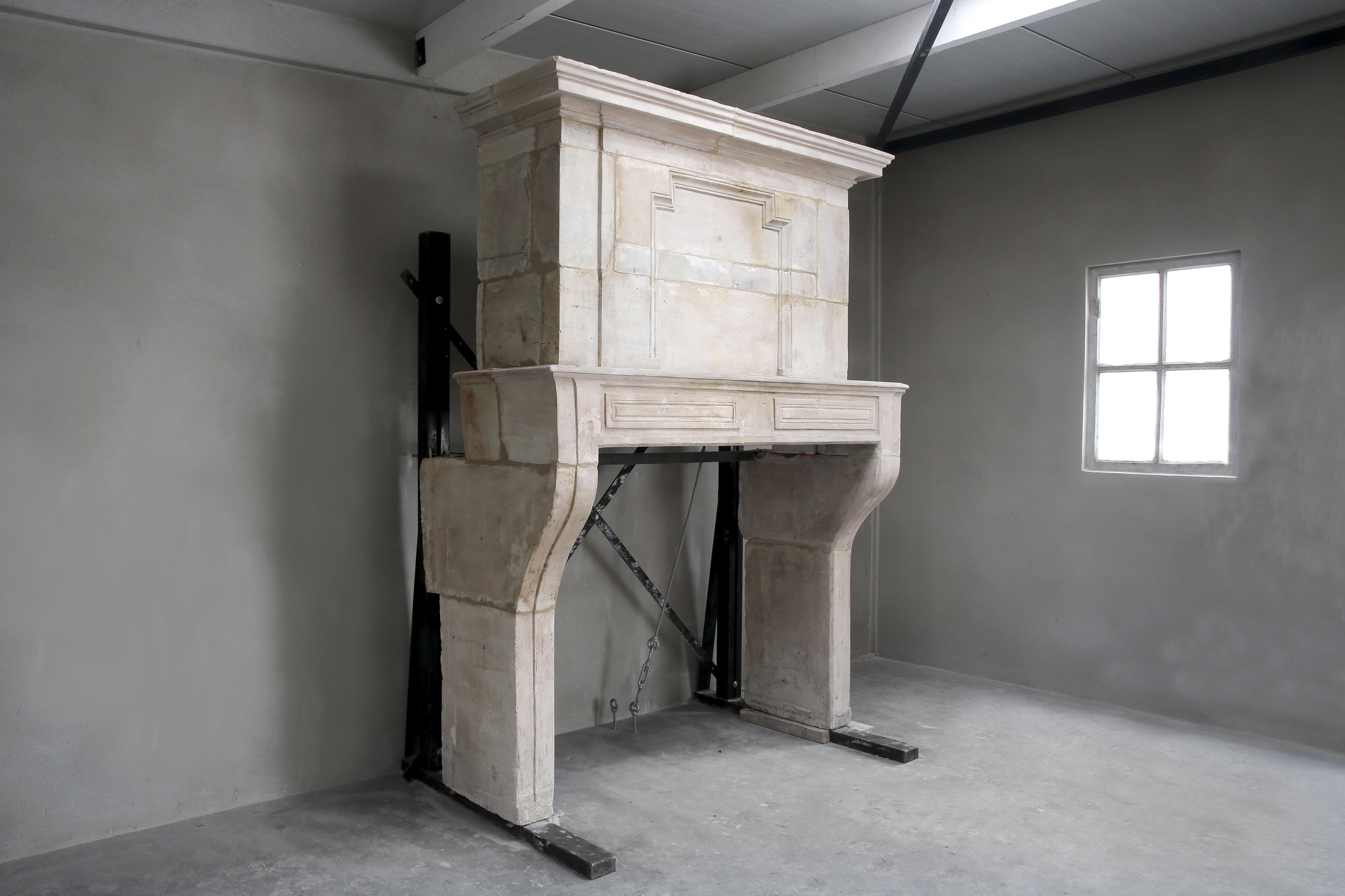 A stately French antique castle chimney with decorative trumeau! A trumeau is the upper part of the chimney. The mantelpiece dates from the 18th century. A beautiful specimen that is a real eyecatcher in your interior! The molding and lines at this