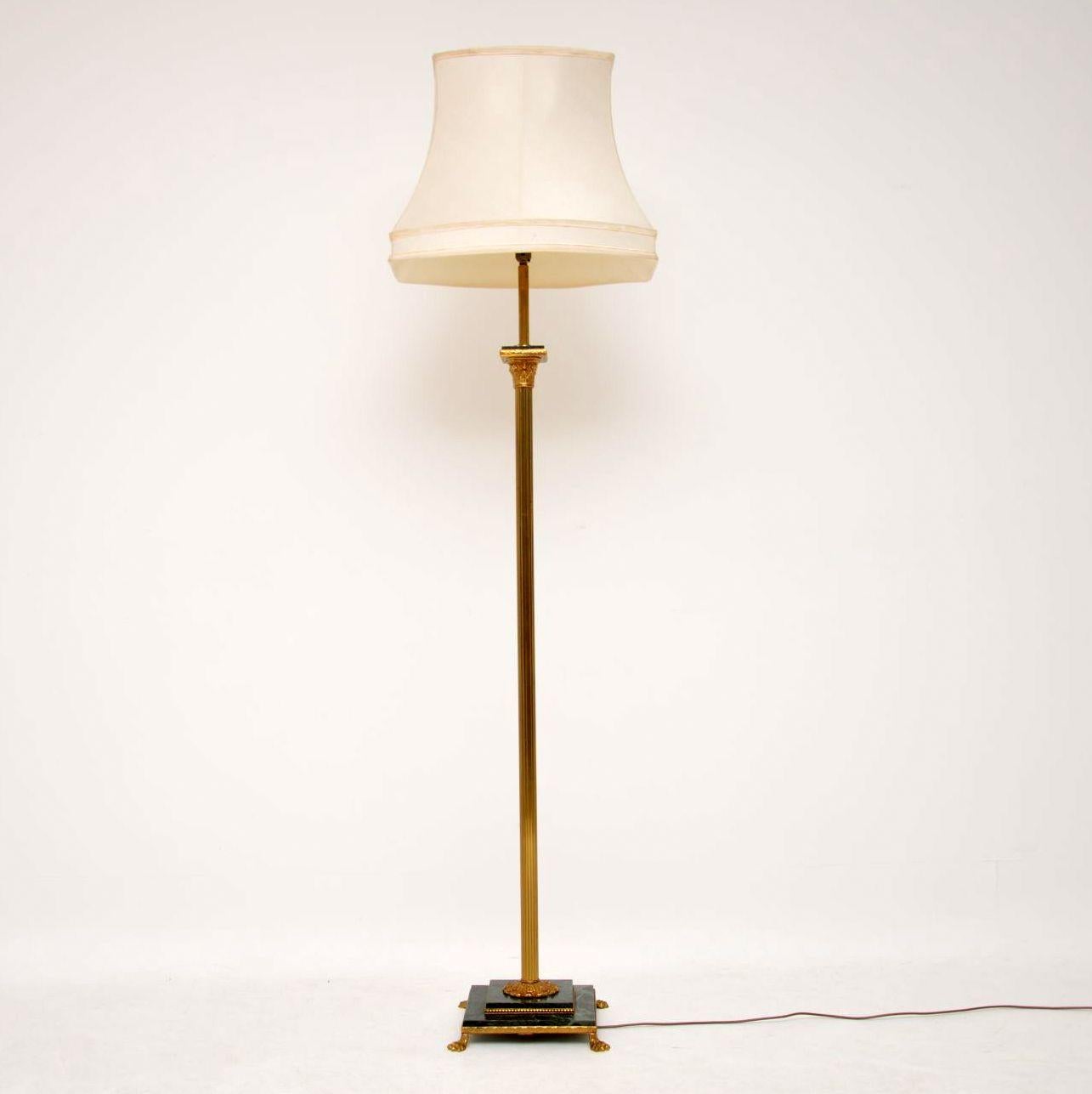 This antique French brass and marble standard lamp is of very good quality and is in working order, having just been re-wired. The design is in the form of a Corinthian column, with fluting and paw feet. The base is marble and there is a smaller