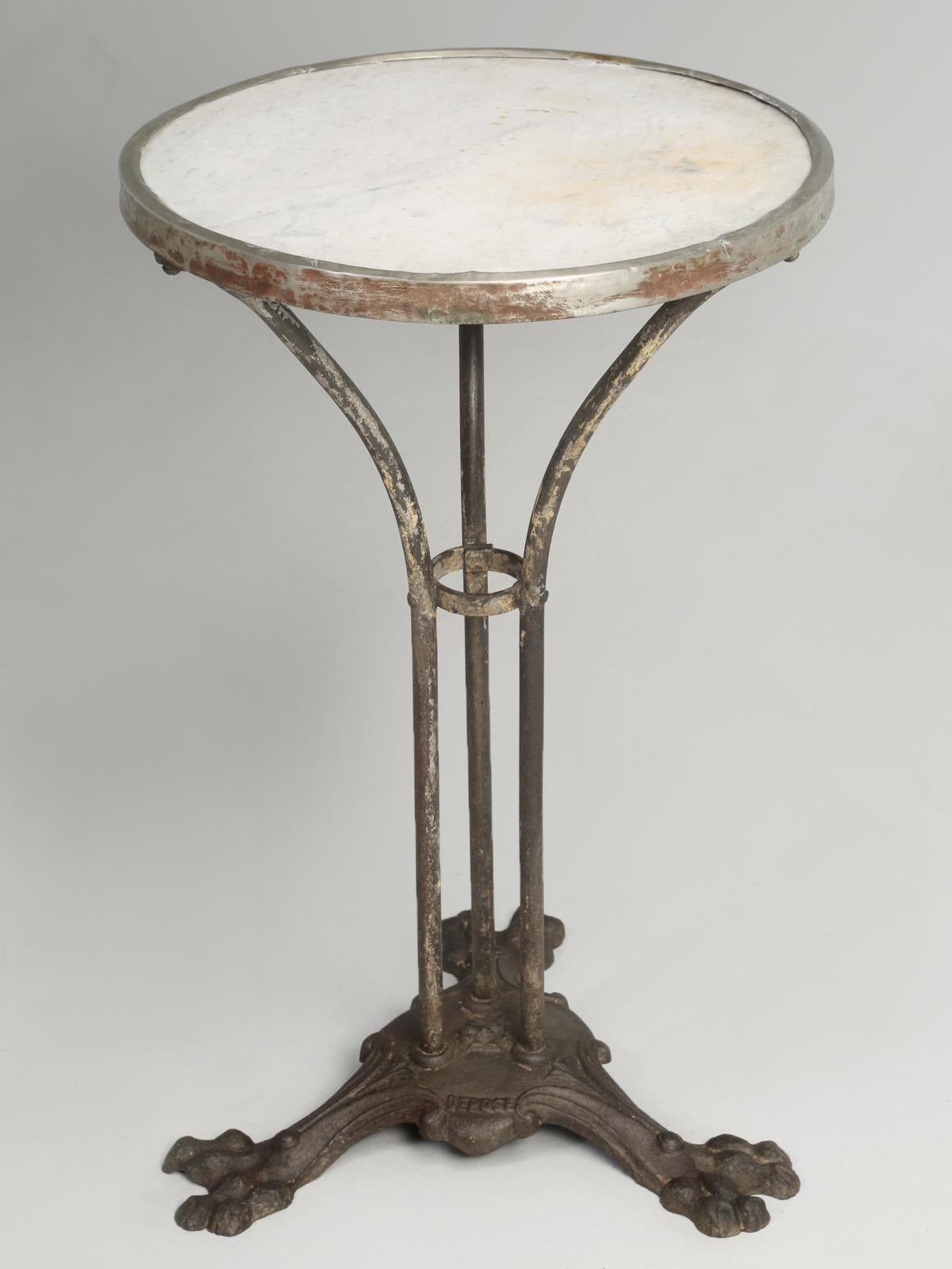 This is a well used Bistro table with excessive patina and if you are looking for a pristine example of an antique French Bistro table, then this marble and iron Bistro table is not for you. The Bistro table is structurally sound and as we described