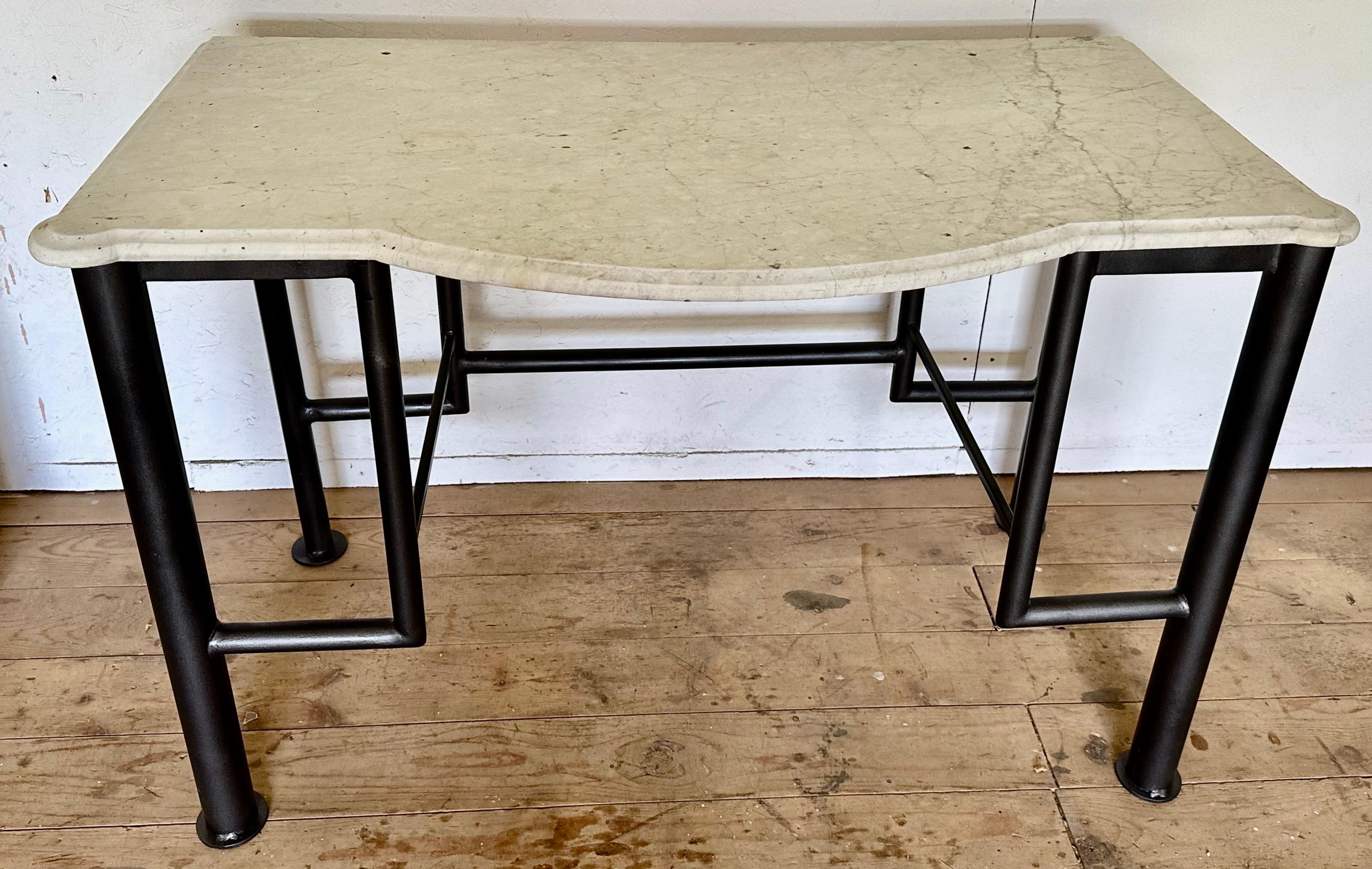 Make a statement with this unusual washstand created by combining the antique French marble top with rounded corners and half round front and a mid-century modern metal stand that has been newly refinished.
Use it as it or as a base with vessel wash